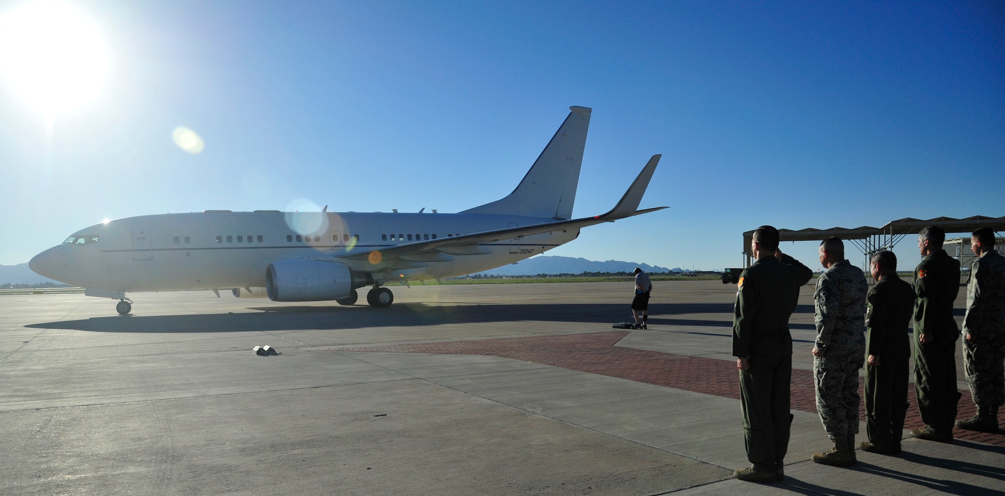 Luke Air Force Base leaders salute Gen. Philip Breedlove, NATO supreme allied commander, Europe and the commander of U.S. European Command, as the aircraft taxis in Sept. 11 at the red carpet. During his visit, Breedlove was briefed on the Luke mission, spoke to Airmen, and answered questions at an all-call. (U.S. Air Force photo/Senior Airman Grace Lee)