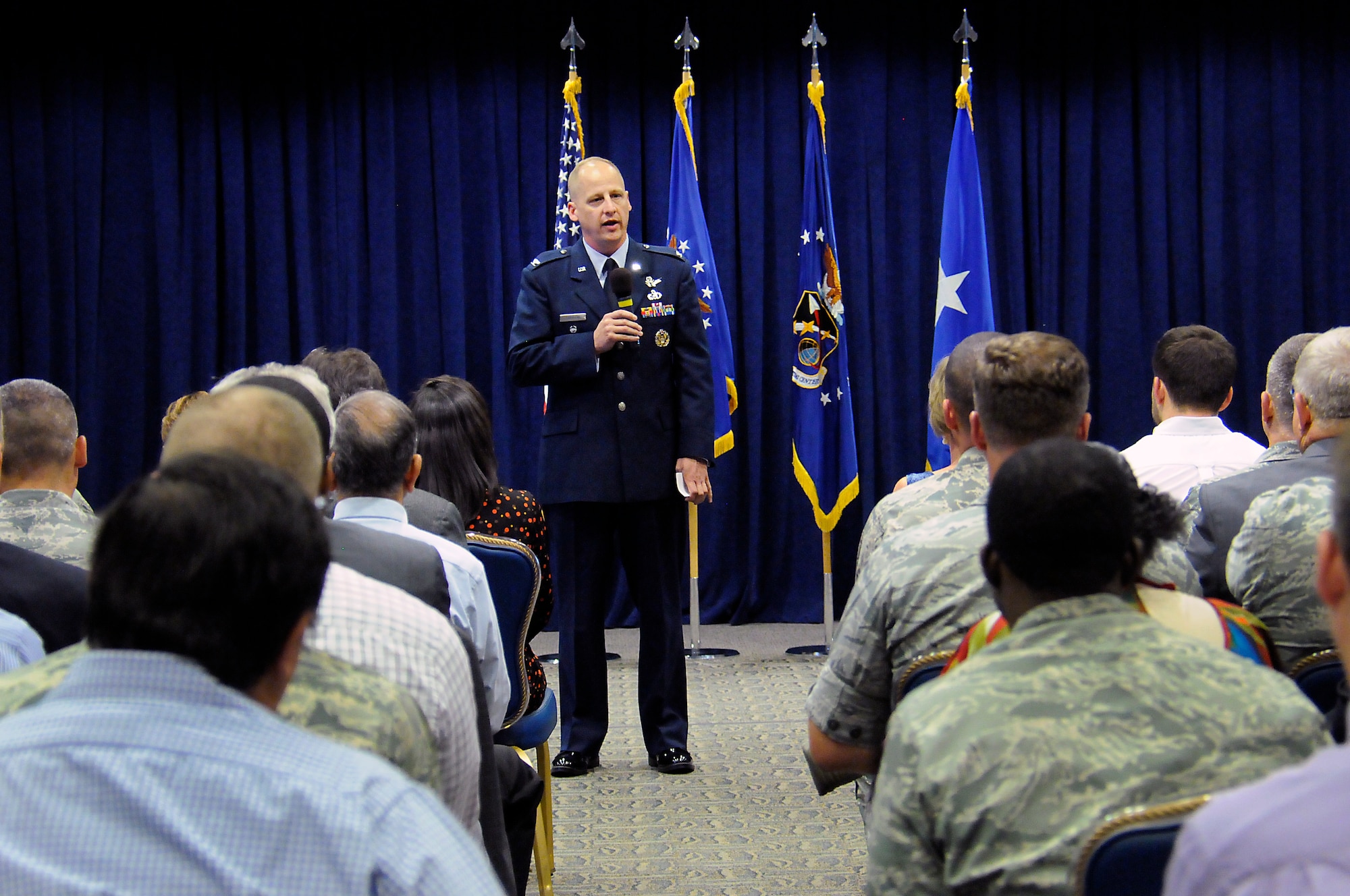 During a ceremony officiated by Lt. Gen. Sam Greaves, Space and Missile Systems commander, Sept. 8 at Los Angeles Air Force Base, El Segundo, Califl, Col. Mike Guetlein took command of SMC’s Remote Sensing Systems Directorate from Col. James Planeaux. Guests at the ceremony included family, friends and dignitaries such as William Maikisch, SMC’s former executive director. (Photo by Joe Juarez)