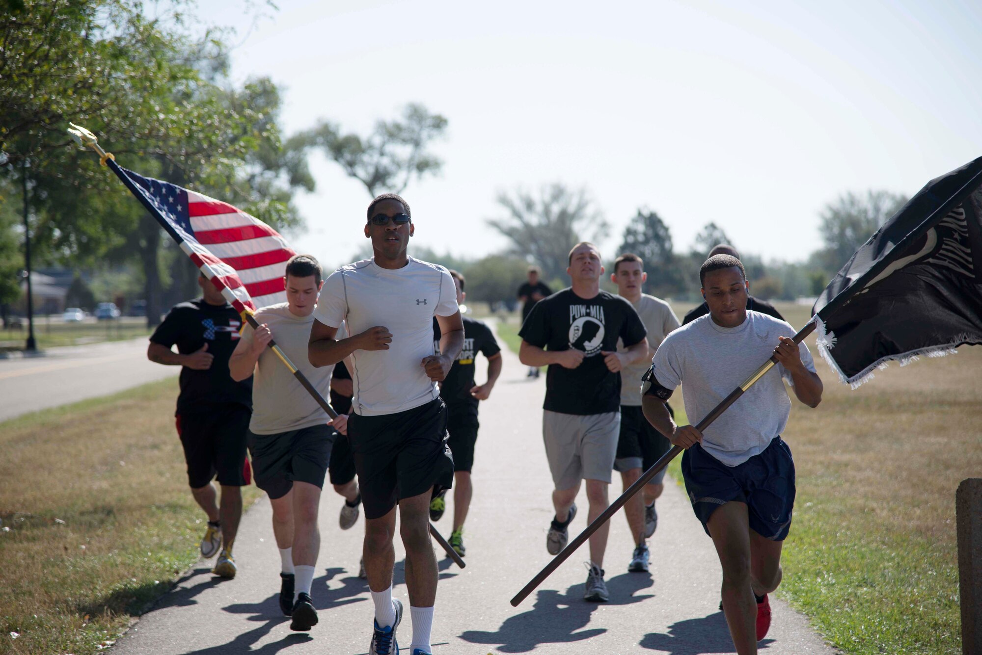 Airmen from 90th Missile Maintenance Group march on F.E. Warren Air Force Base, Wyo., Sept. 16, 2014, in honor of prisoners of war and those who are missing in action. Military installations country-wide conducted events in observance of POW/MIA remembrance week. (U.S. Air Force photo by Lan Kim)