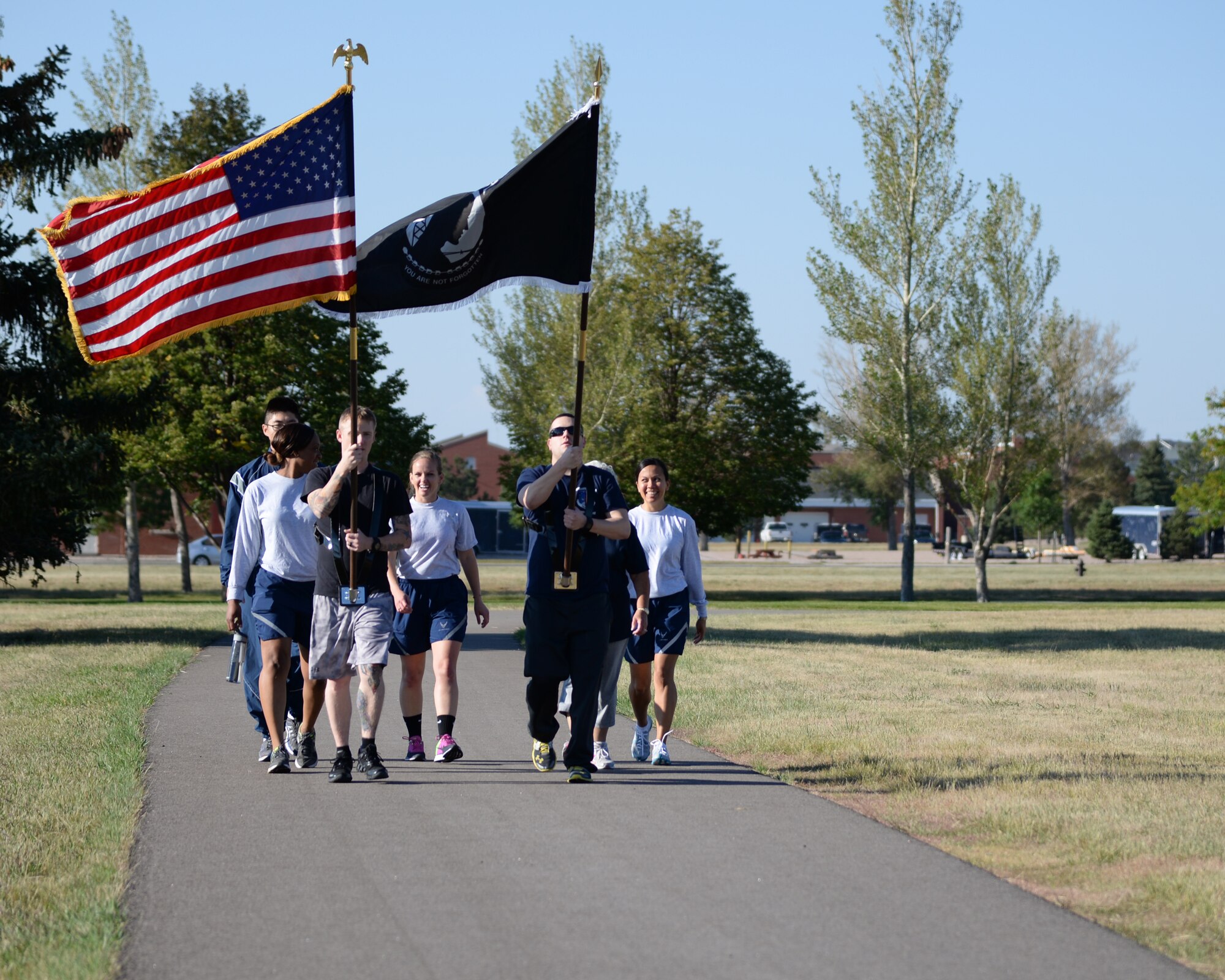 Airmen from 90th Missile Wing Staff and 90th Comptroller Squadron march on F.E. Warren Air Force Base, Wyo., Sept. 16, 2014, in honor of prisoners of war and those who are missing in action. Military installations country-wide conducted events in observance of POW/MIA Remembrance Week. (U.S. Air Force photo by Lan Kim)