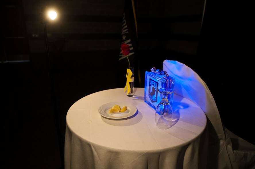 A POW/MIA table sits in the ballroom during a ceremony at the Air Force Ball Sept. 19, 2014, in Valdosta, Ga. The ceremony was held to pay tribute to those military members who have yet to return from defending America. (U.S. Air Force photo by Senior Airman Olivia Bumpers/Released)