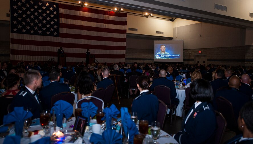 Airmen and guests watch a video at the Air Force Ball Sept. 19, 2014, in Valdosta, Ga. The video was a compilation of Airmen explaining why they joined the Air Force. (U.S. Air Force photo by Senior Airman Olivia Bumpers/Released)