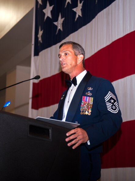 Retired Command Chief Master Sgt. Rick Parsons speaks to attendees at the Air Force Ball Sept. 19, 2014, in Valdosta, Ga. Parsons spoke about how Airmen should be proud of the accomplishments we [Air Force] have made and are continuing to make. (U.S. Air Force photo by Senior Airman Olivia Bumpers/Released)