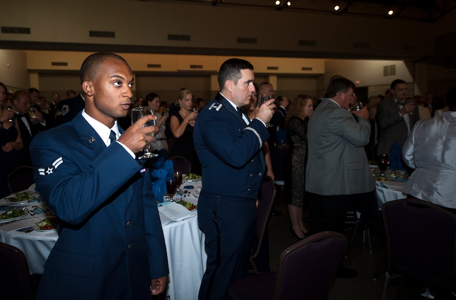 Members of Team Moody and guests participate in a toast during a POW/MIA ceremony during the Air Force Ball Sept. 19, 2014, in Valdosta, Ga. Hundreds gathered to celebrate the Air Force’s 67th year as a separate service. (U.S. Air Force photo by Senior Airman Olivia Bumpers/Released)