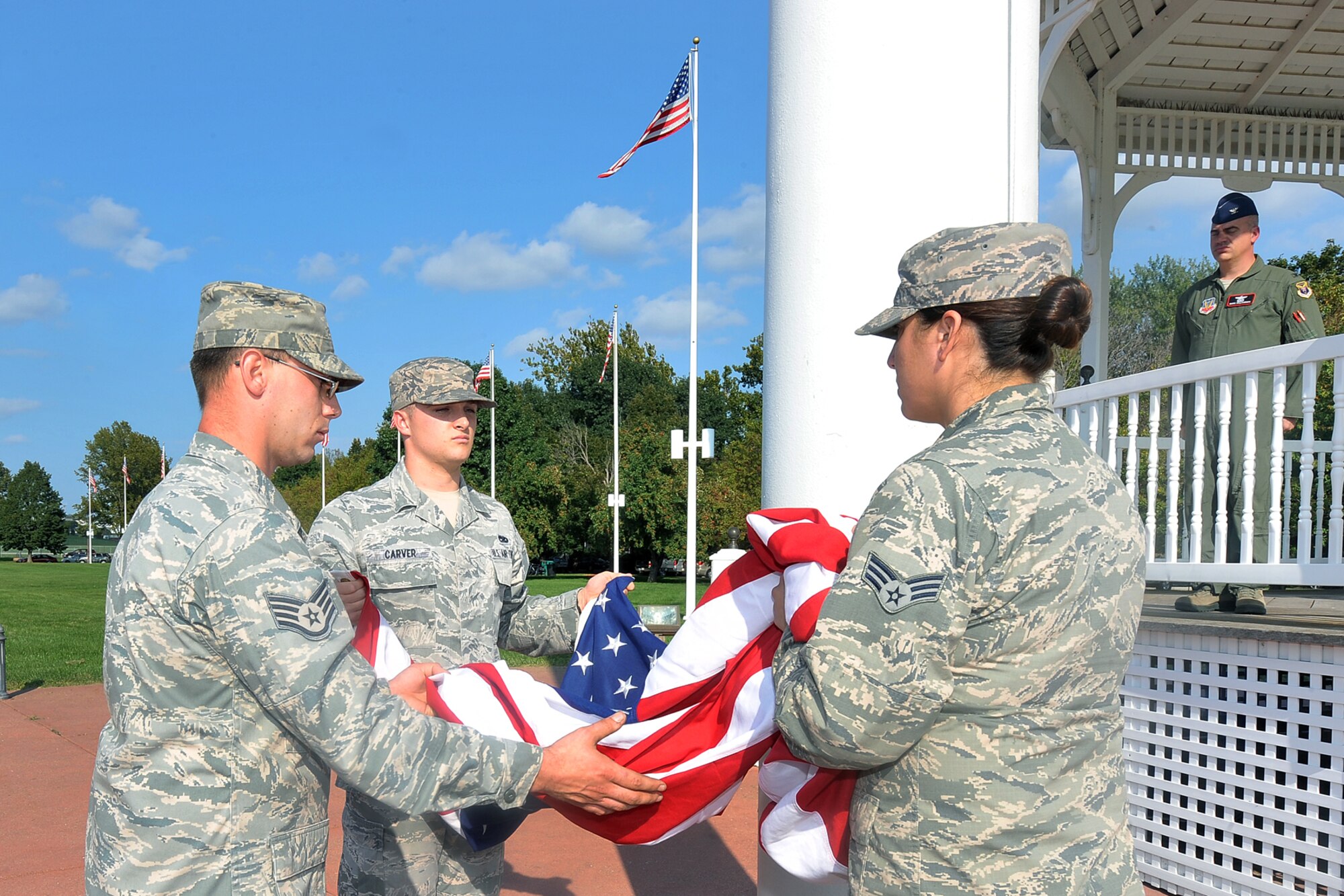 Team Offutt members prepare to fold the U.S. flag during the Air Force Birthday retreat ceremony on the parade grounds Sept. 18. Today’s Air Force is comprised of more than 680,000 Airmen, made up of active duty, reservists, guardsmen and civilians, who support more than 5,600 aircraft, 450 intercontinental ballistic missiles and 63 satellites. (U.S. Air Force Photo by Charles Haymond)