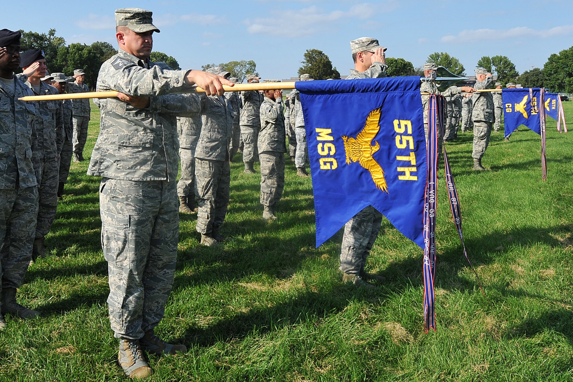 Team Offutt members salute the U.S. flag during the Air Force Birthday retreat ceremony on the parade grounds Sept. 18. This year is the Air Force’s 67th birthday. (U.S. Air Force Photo by Charles Haymond)