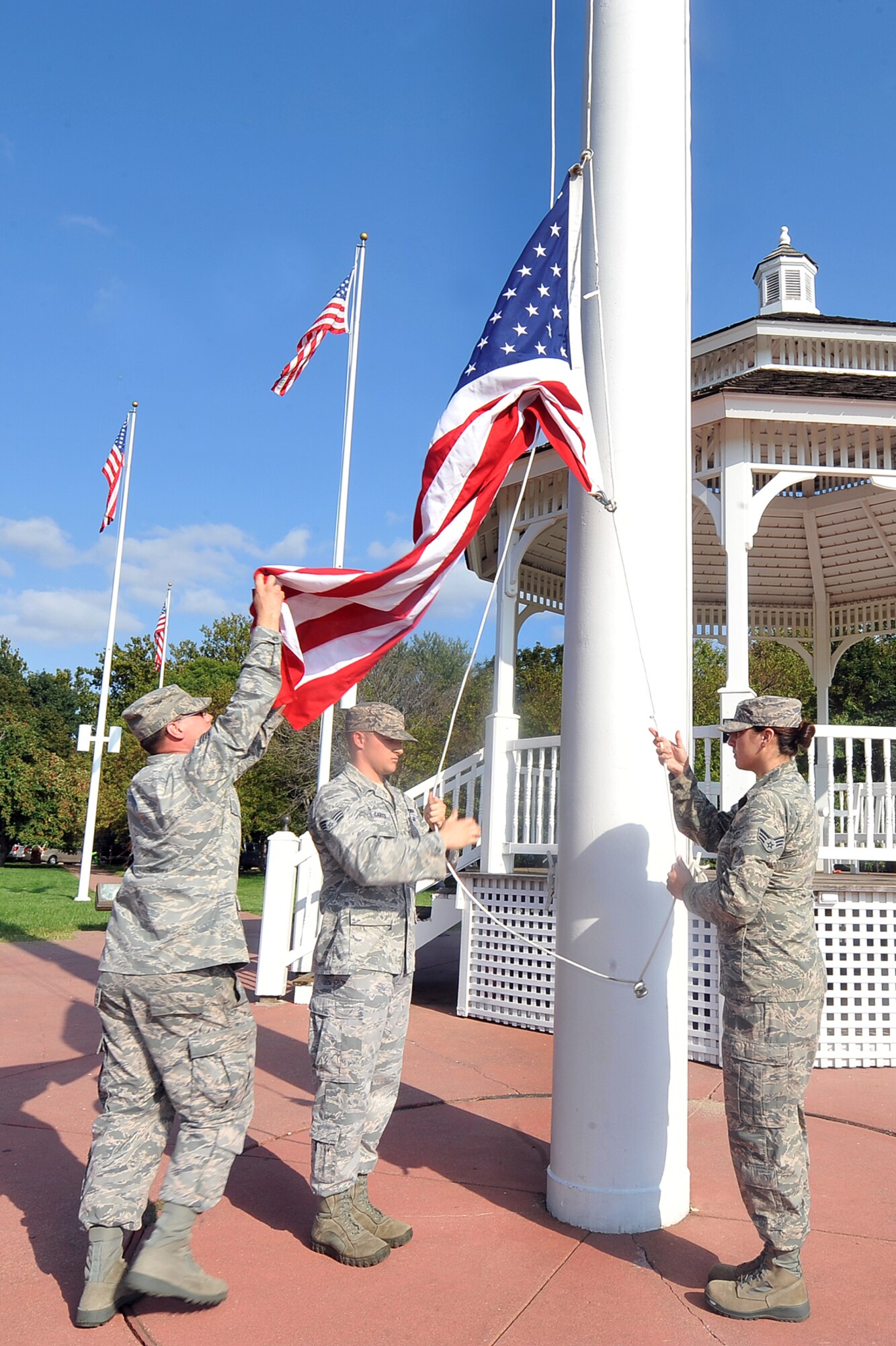 Team Offutt members prepare to fold the U.S. flag during the Air Force Birthday retreat ceremony on the parade grounds Sept. 18. Though Sept. 18, 1947 is seen as the official birth of the Air Force as we know it today, the truth is that the Air Force has a rich history that can be traced as far back as to the Civil War with the Union Army Balloon Corps. (U.S. Air Force Photo by Charles Haymond)