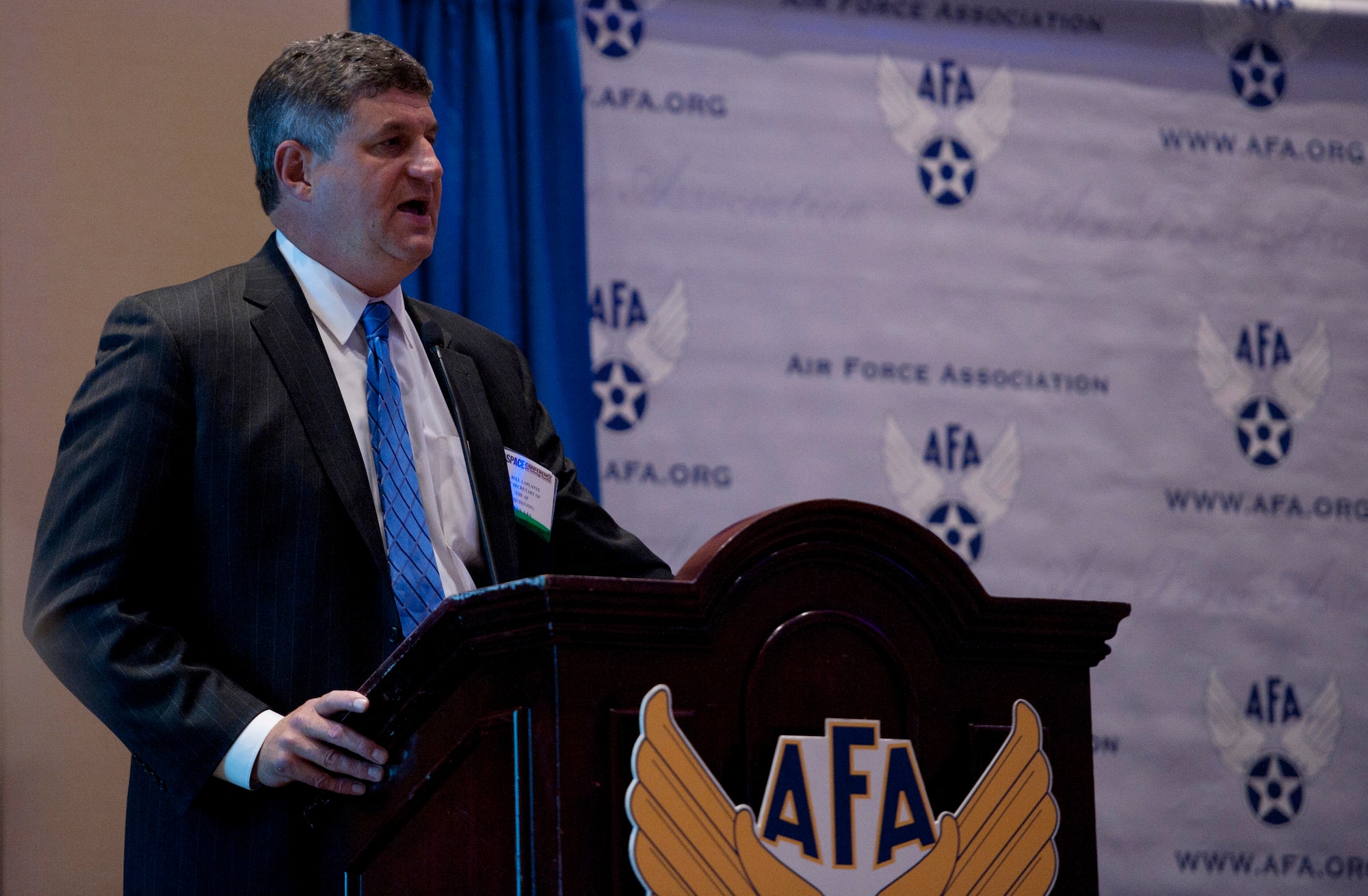 Dr. William LaPlante talks to attendees about Air Force acquisition during the 2014 Air Force Association's Air & Space Conference and Technology Exposition Sept. 16, 2014, in Washington D.C. LaPlante is the assistant secretary of Air Force acquisition. He directs more than $35 billion annual investments that include major programs like the KC-46 Pegasus, F-22 Raptor, F-35 Lightning II, C-17 Globemaster, Space acquisitions, munitions, as well as capability areas such as information technology and command and control, intelligence, surveillance and reconnaissance, or C4ISR, systems. (U.S. Air Force photo/Staff Sgt. Anthony Nelson Jr.)
