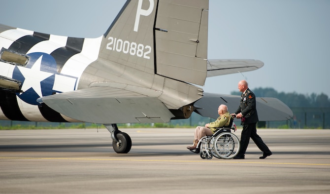 Then U.S. Army Private 1st Class Mario Patruno, 101st Airborne Division, 506th Company F paratrooper, gazes at a C-47 Skytrain, Eindhoven, Netherlands, Sept. 20, 2014. Patruno participated in both D-Day and Operation Market Garden 70 years ago. During the commemoration of Operation Market Garden he visited with paratroopers before they reenacted the exact jump he made all those years ago. (U.S. Air Force photo/Senior Airman Damon Kasberg)