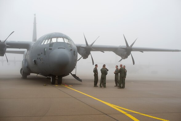Members of the 37th Airlift Squadron wait for the fog to clear from the flightline of Eindhoven, Netherlands, Sept. 20, 2014. The 37th AS took part in a reenactment of Operation Market Garden to honor those who were lost during the liberation of the Netherlands in World War II. Weather played a major role in the operation, hindering many aircraft from being able to complete their mission, but the 37th AS was still able to drop paratroopers to commemorate the 70th Anniversary of the operation. (U.S. Air Force photo/Senior Airman Damon Kasberg)