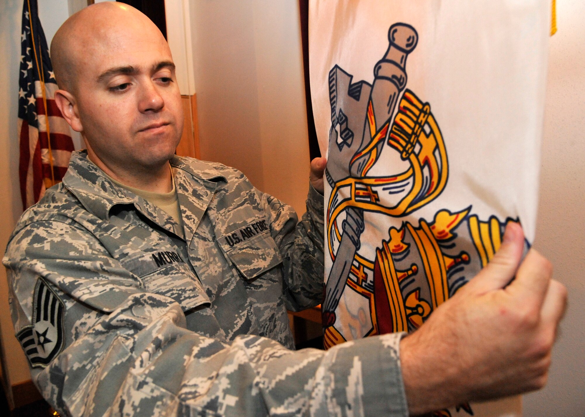 U.S Air Force Staff Sgt. Ronald Murray, 509th Bomb Wing chaplain assistant, prepares for Catholic services at Whiteman Air Force Base, Mo., Sept. 3, 2014. The chaplain assistant has to maintain a neutral setting within the chapel as much as they can throughout the week. The chapel is home to all denominations and must uphold this standard to ensure worshippers are comfortable in their religious surroundings. (Air Force photo by Airman 1st Class Keenan Berry/Released)