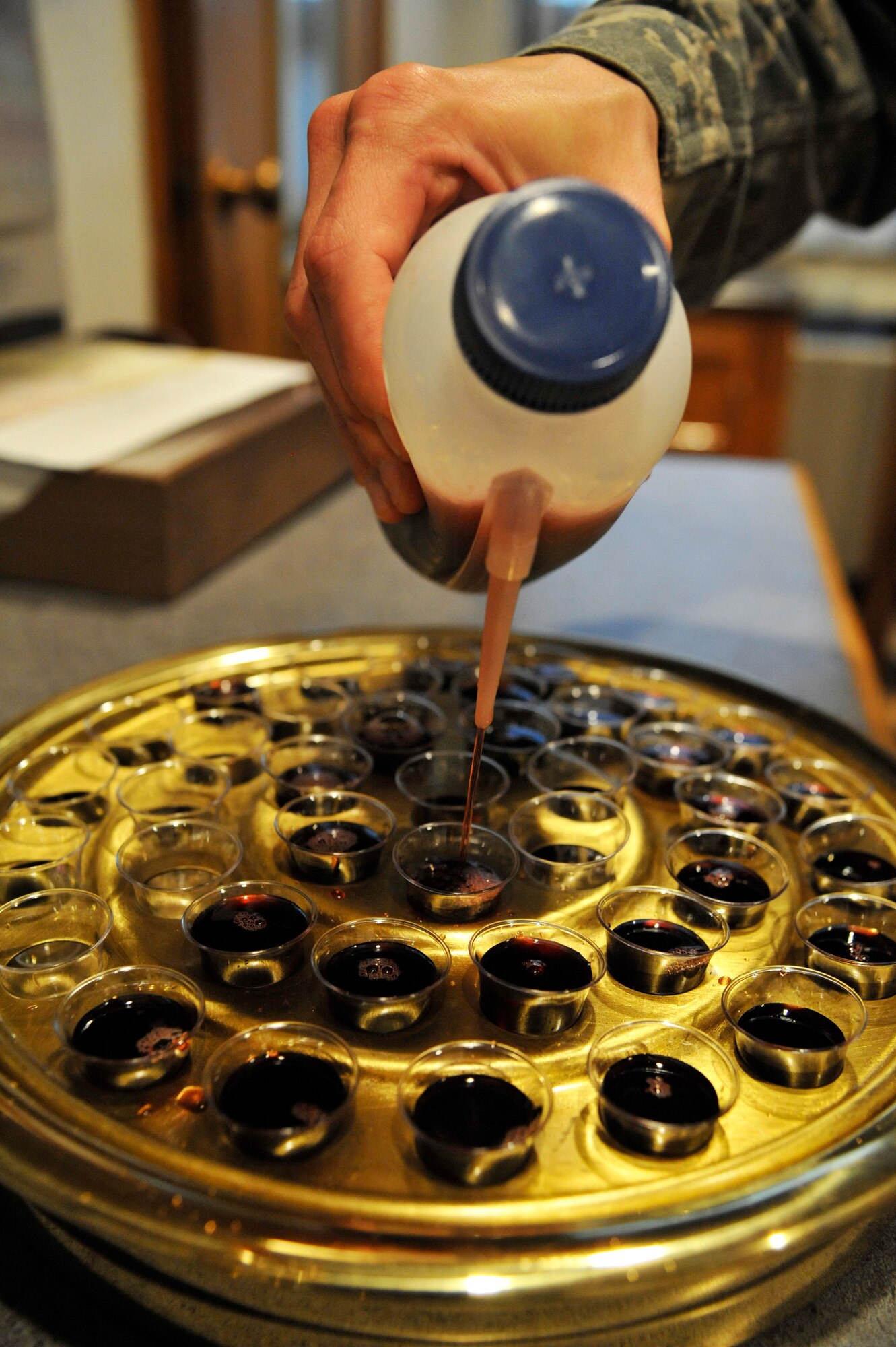 U.S. Air Force Staff Sgt. Ronald Murray, 509th Bomb Wing chaplain assistant, prepares for Protestant communion at Whiteman Air Force Base, Mo., Sept. 3, 2014. Preparing for services is one of the many tasks chaplain assistants do to help chaplains. (U.S. Air Force photo by Airman 1st Class Keenan Berry/Released)