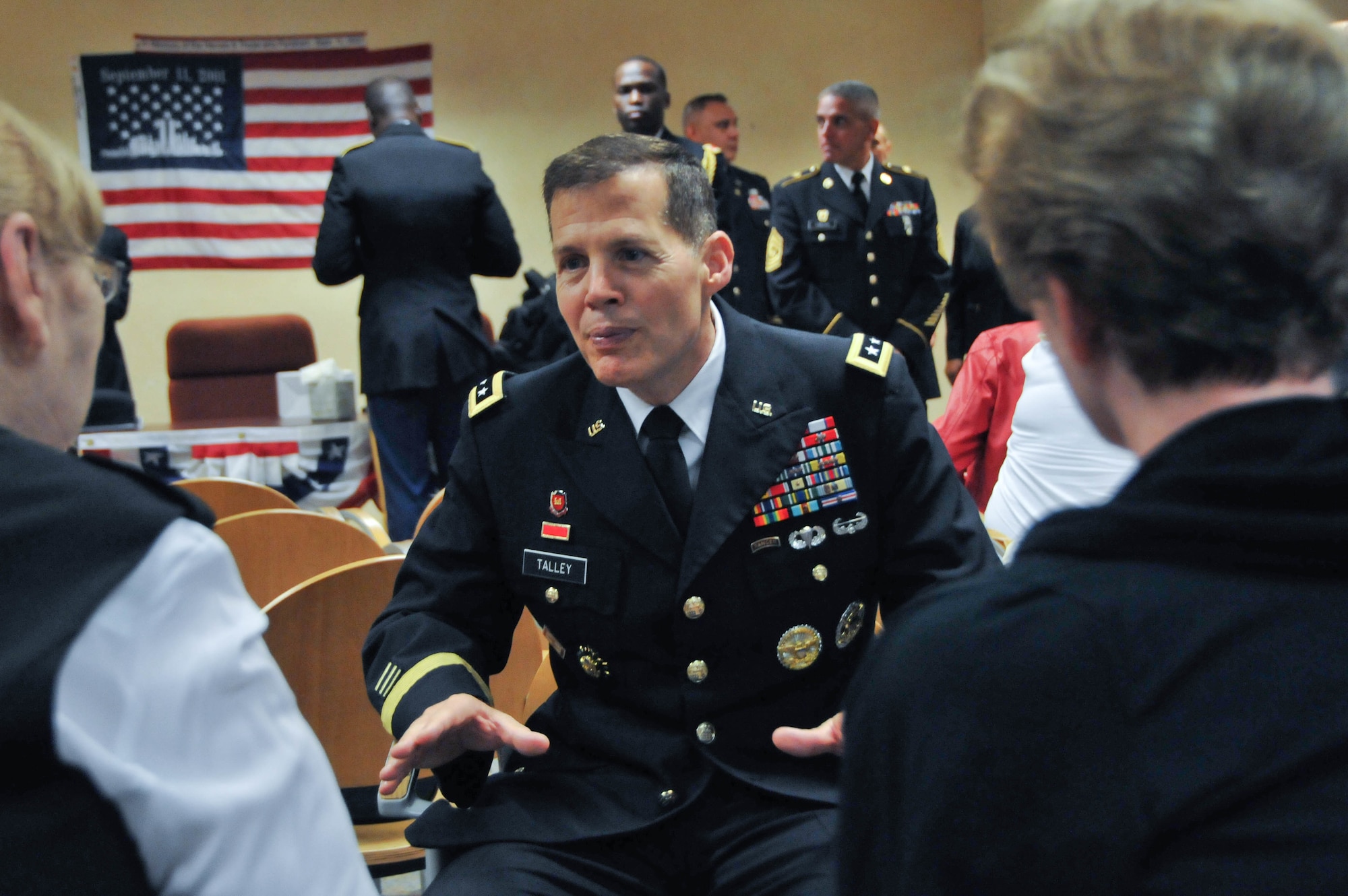 Lt. Gen. Jeffrey W. Talley, chief of Army Reserve and commanding general of United States Army Reserve Command, speaks with families of fallen Army Reserve Soldiers prior to the 9/11 Remembrance Ceremony Sept. 13 at the Ernie Pyle U.S. Army Reserve Center on Fort Totten, N.Y. The event honored six New York-area Army Reserve Soldiers – Lt. Col. William Pohlmann, Capt. Mark Whitford, Capt. Michael Mullan, Warrant Officer Ronald Bucca, Staff Sgt. Frederick Ill and Sgt. Shawn Powell - who were killed in the terrorist attacks against the United States on Sept. 11, 2001. (U.S. Army photo by Staff Sgt. Shawn Morris/Released)