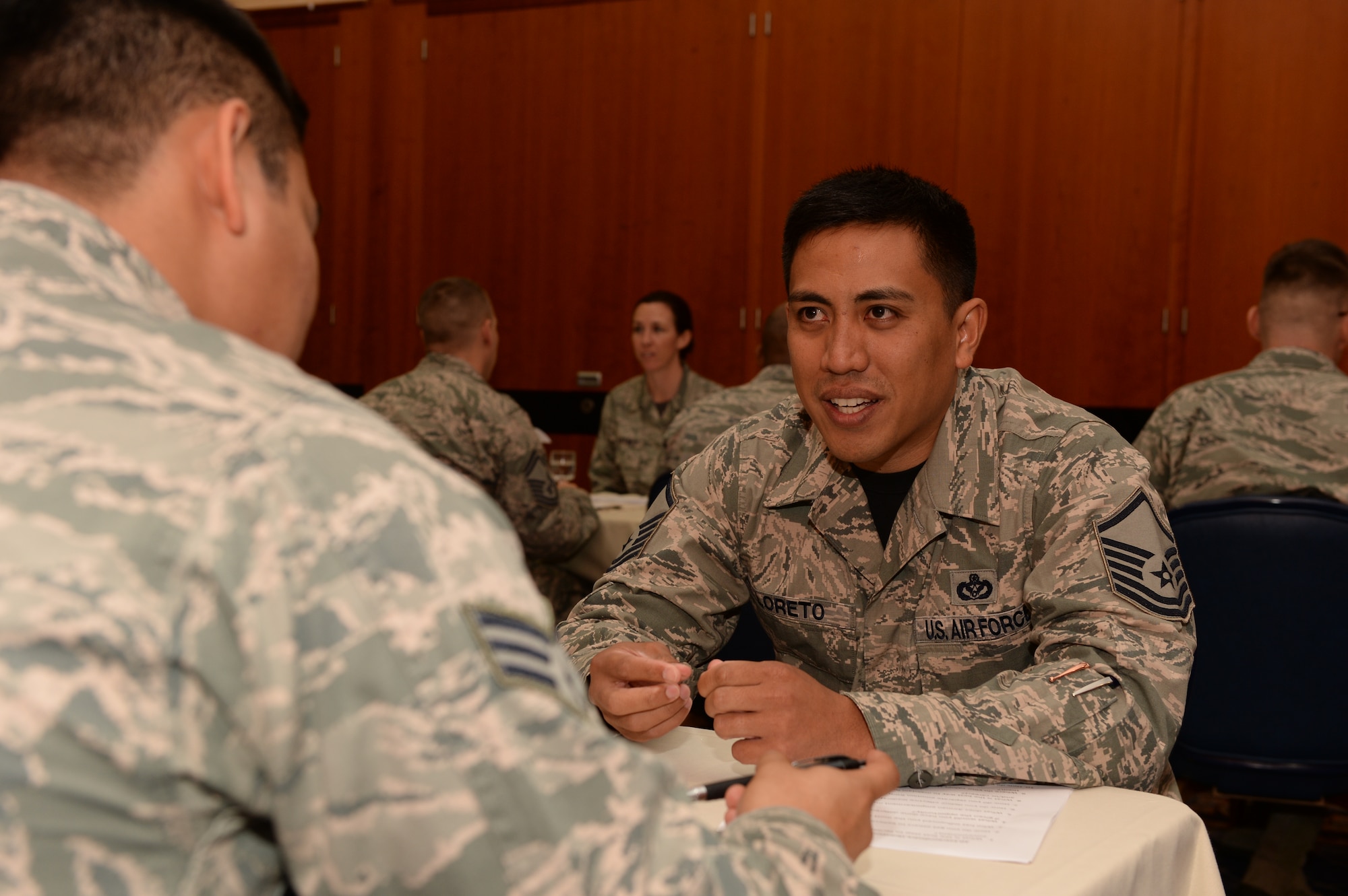 U.S. Air Force Master Sgt. Richard Loreto, 52nd Civil Engineer Squadron superintendent of unaccompanied housing from San Francisco, right, mentors U.S. Air Force Senior Airman Lawrence Westmoreland, a 52nd Comptroller Squadron financial services journeyman from Washington D.C., during the 52nd Fighter Wing’s inaugural speed mentoring event Sept. 19, 2014, at Spangdahlem Air Base, Germany. The event was hosted by Spangdahlem Top III, a private organization composed of senior NCOs. (U.S. Air Force photo by Airman 1st Class Dylan Nuckolls/Released)