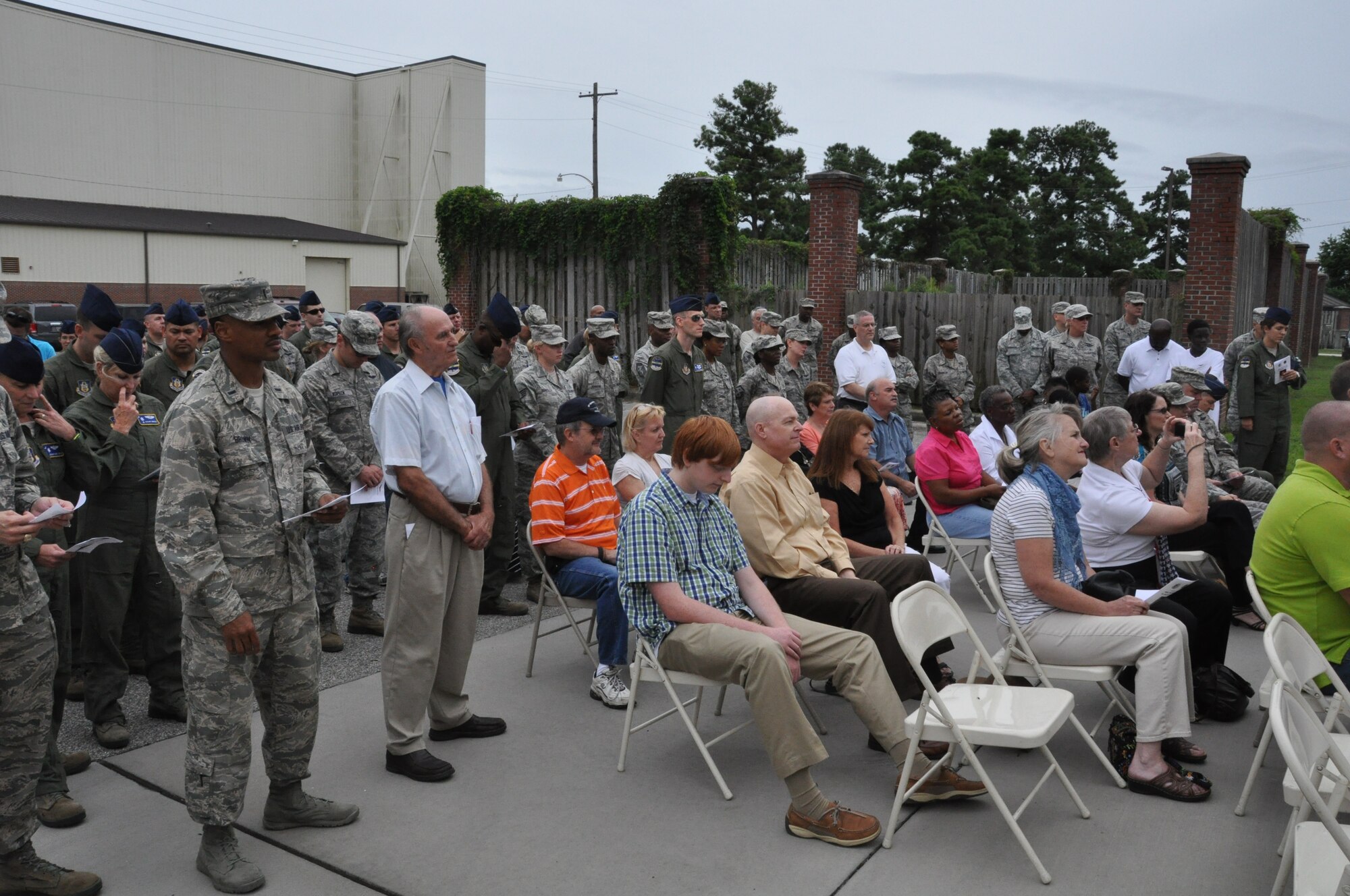 Members of the 315th Airlift Wing listen in as Building 416 is officially named the Master Sergeant Ronald A. Hall Aeromedical Evacuation Operations Facility during a dedication ceremony held at Joint Base Charleston, S.C. The building was named after Master Sgt. Ronald Hall, who spent 24 of his 28 years in the Air Force as a member of the 315th Aeromedical Evacuation Squadron. After years of dedicated service to the military, Hall passed away in May 2011. (U.S. Air Force photo by Capt. Michaela Judge)