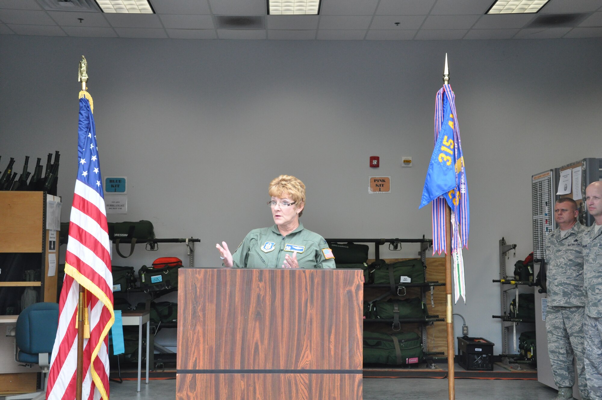 Col. Diane DiFrancesco, 315th Aeromedical Evacuation Squadron commander, gives remarks during the dedication ceremony of the Master Sergeant Ronald A. Hall Aeromedical Evacuation Operations Facility Sept. 21, 2014 at Joint Base Charleston, S.C. The building was officially named after Master Sgt. Ronald Hall, who spent 24 of his 28 years in the Air Force as a member of the 315th Aeromedical Evacuation Squadron. After years of dedicated service to the military, Hall passed away in May 2011. (U.S. Air Force photo by Capt. Michaela Judge)