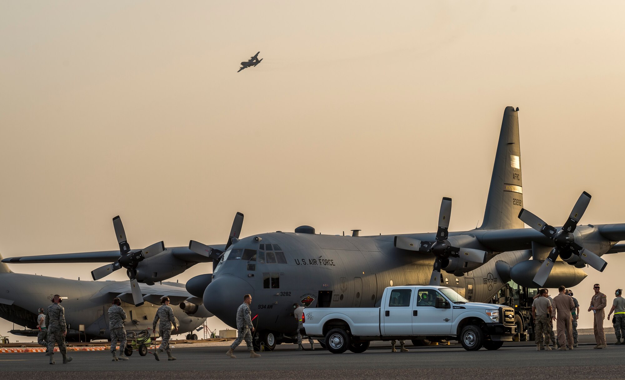 Airmen of the 934th Air Wing unload after landing at their new home Sept. 12, 2014 at an undisclosed location in Southwest Asia. The crews will be stationed with the 386th Air Expeditionary Wing for the next four months and deployed from Minneapolis-St Paul Air Reserve Station, Minn. in support of Operation Enduring Freedom. (U.S. Air Force photo by Staff Sgt. Jeremy Bowcock)