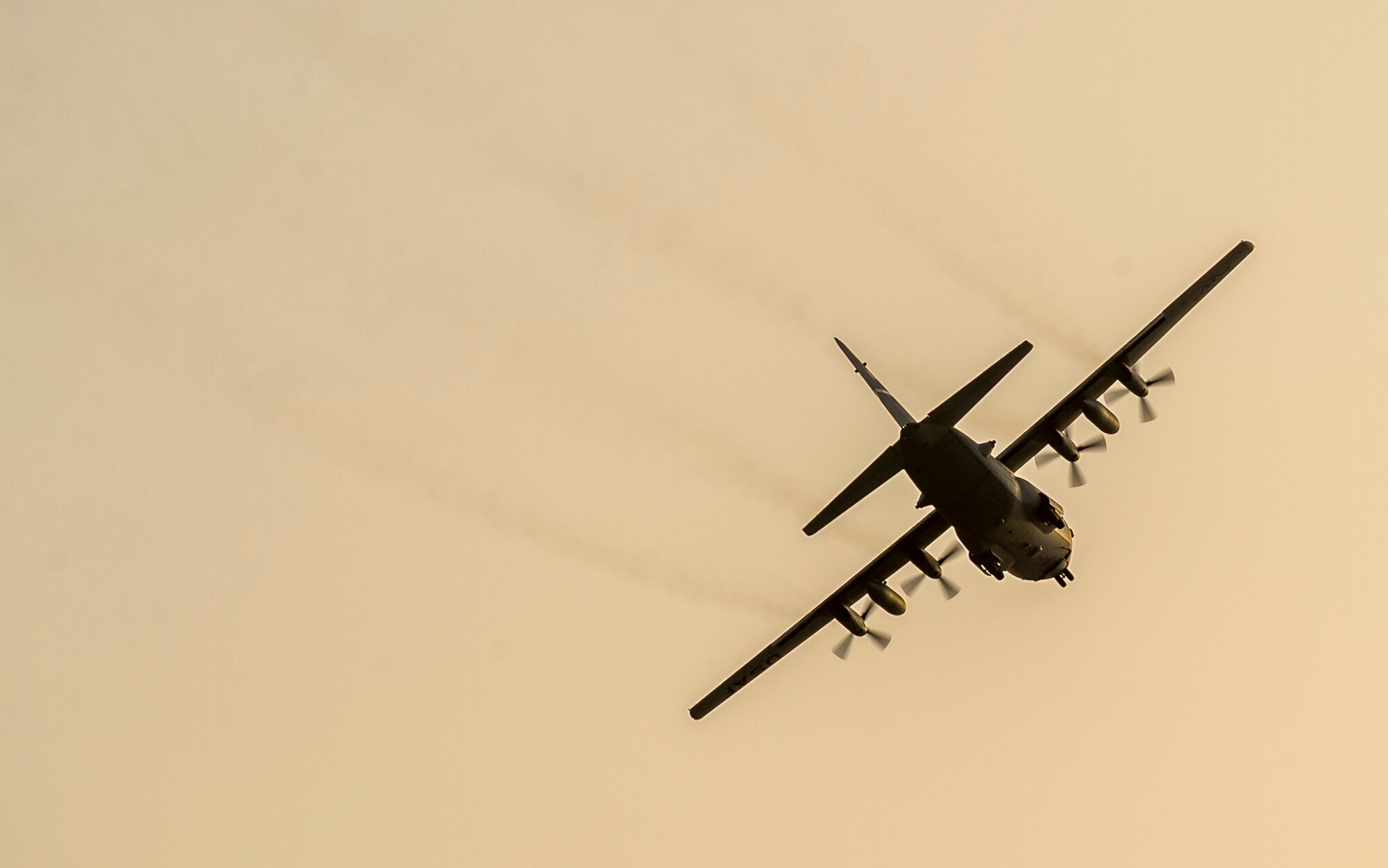 A C-130H Hercules from the 934th Air Wing flies overhead before landing at its new home Sept. 12, 2014 at an undisclosed location in Southwest Asia. The crew will be stationed with the 386th Air Expeditionary Wing for the next four months and deployed from Minneapolis-St Paul Air Reserve Station, Minn. in support of Operation Enduring Freedom. (U.S. Air Force photo by Staff Sgt. Jeremy Bowcock)
