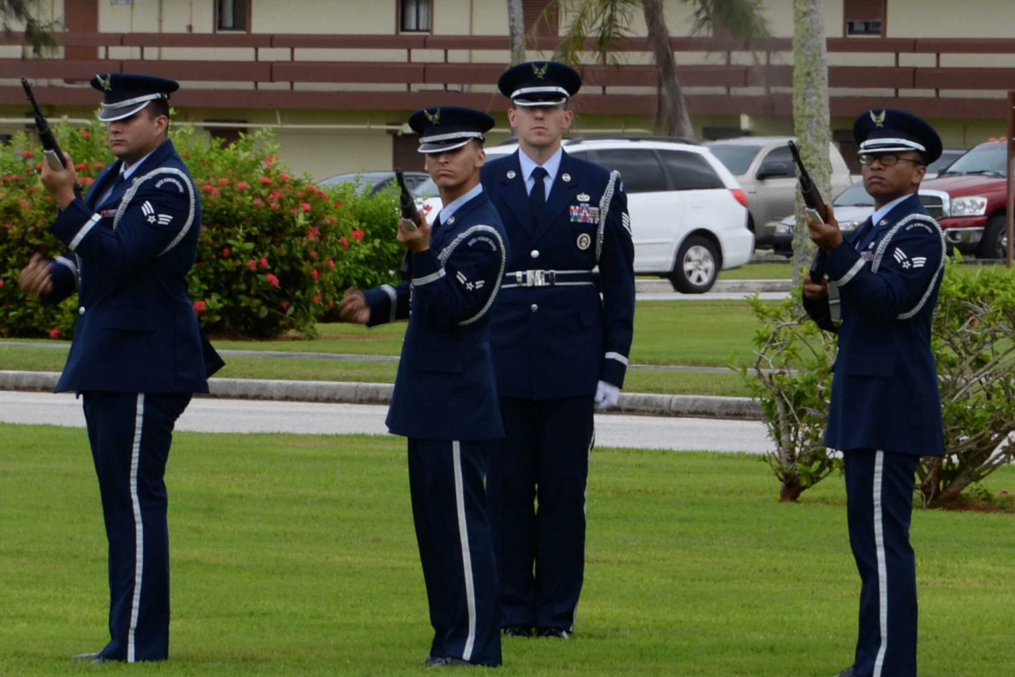 Andersen Air Force Base Honor Guard members perform a firing party sequence honoring the prisoners of war and those missing in action during a retreat ceremony Sept. 19, 2014, on Andersen Air Force Base, Guam. The retreat ceremony ended the week’s events that included a ruck march, a 5K run and challenge and a 24-hr vigilance run. (U.S. Air Force photo by Senior Airman Cierra Presentado/Released)