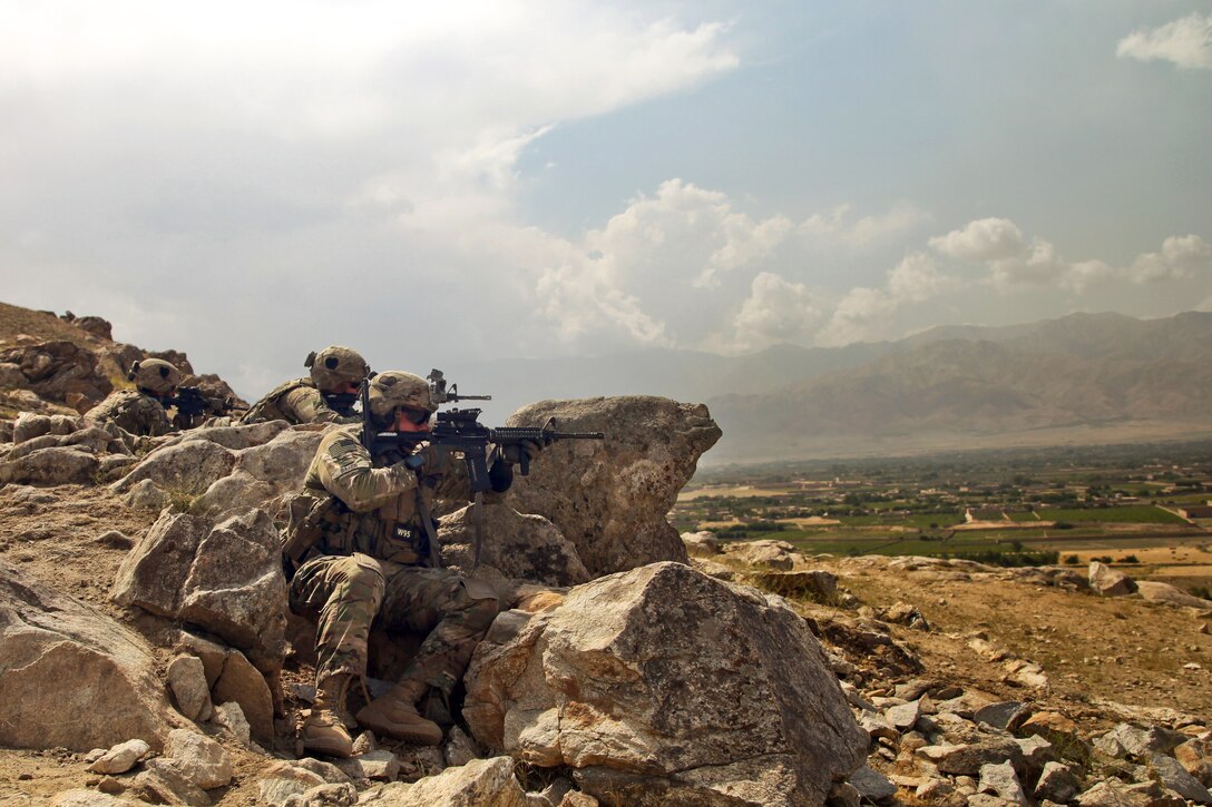 U.S. Army Sgt. Jacob Baker, right, U.S. Army 1st Lt. Kenneth J. Hurst, center, and U.S. Army Spc. Tyler Buchanan, left, use high ground to look for potential threats in Parwan province, Afghanistan, Sept. 8, 2014. Baker, Hurst and Buchanan are assigned to the 101st Airborne Division's 1st Battalion, 75th Cavalry Regiment, 2nd Brigade Air Assault.