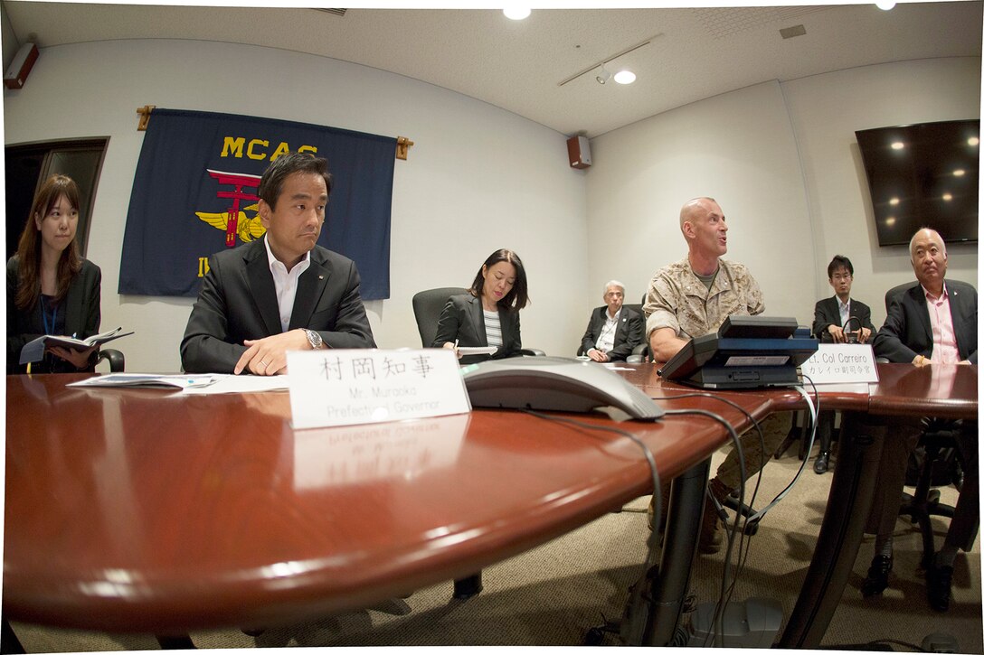 Tsugumasa Muraoka, governor of Yamaguchi Prefecture, and other distinguished visitors, tour Marine Corps Air Station Iwakuni, Japan, Sept. 22, 2014. This was Muraoka's first time aboard station since being elected to governor. The intention of the visit was to deepen the governor's understanding of MCAS Iwakuni.