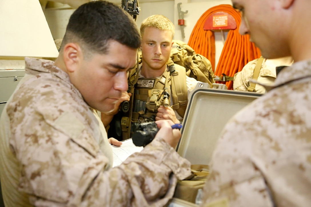 U.S. Marine Staff Sgt. Edward J. Gonzalez, left, platoon sergeant, Fox Company, Battalion Landing Team 2nd Battalion, 1st Marines (BLT 2/1), 11th Marine Expeditionary Unit (MEU), and El Paso, Texas native, conducts a gear inventory as part of a mission preparation drill aboard the USS San Diego (LPD 22), Sept 17.  San Diego is part of the Makin Island Amphibious Ready Group and, with the embarked 11th Marine Expeditionary Unit, is deployed in support of maritime and theater security operations in the U.S. 5th Fleet area of responsibility. (U.S. Marine Corps photos by Gunnery Sgt. Rome M. Lazarus/Released)