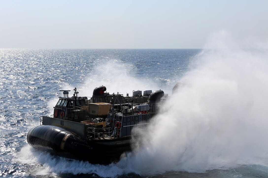 A landing craft, air cushion transporting Marines and equipment with the 11th Marine Expeditionary Unit leaves the USS Comstock (LSD 45) for routine operations, Sept. 19. The 11th MEU is deployed with the Comstock as a theater reserve and crisis response force throughout U.S. Central Command and the U.S. 5th Fleet area of responsibility. 