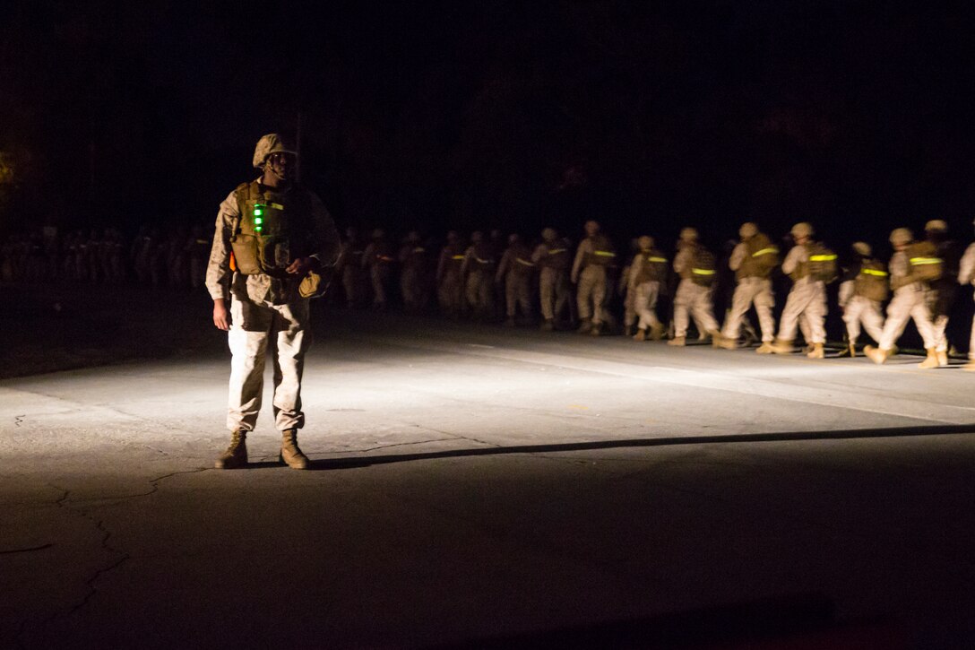 Service members with Headquarters and Service Companies, Headquarters Regiment, 2nd Marine Logistics Group conducted a hike to condition the Marines and sailors for future training exercises with II Marine Expeditionary Force aboard Marine Corps Base Camp Lejeune, N.C., Sept. 19, 2014. The hikes are used for the preparation and sustainment of II MEF units and personnel for upcoming operations.