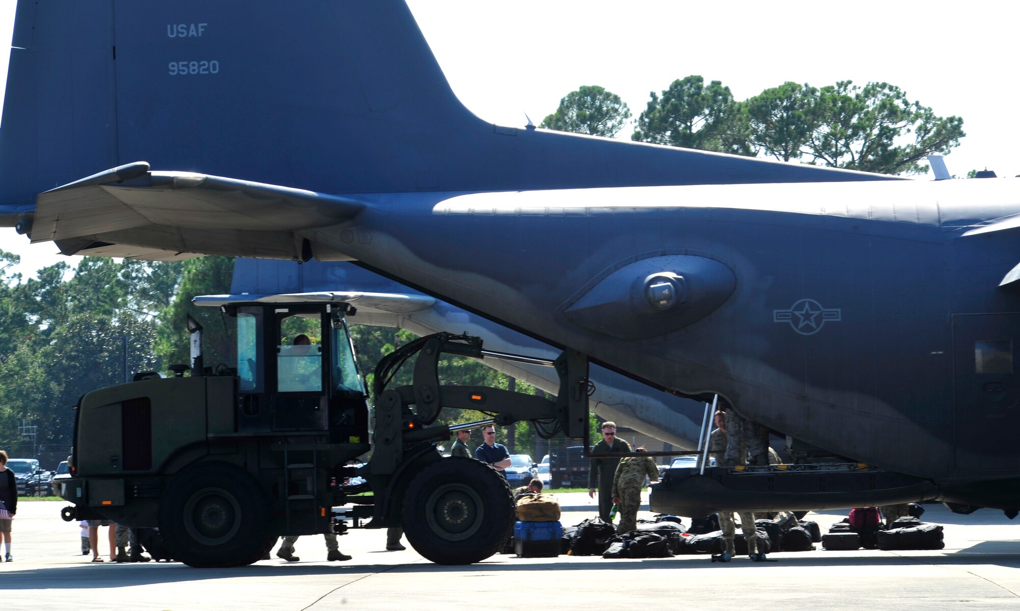 Airmen use a forklift to unload an MC-130P Combat Shadow at Hurlburt Field, Fla., Sept. 19, 2014. The Combat Shadows completed their final combat deployment. The entire fleet will be retired next summer. (U.S. Air Force photo by Staff Tyler Placie)                               