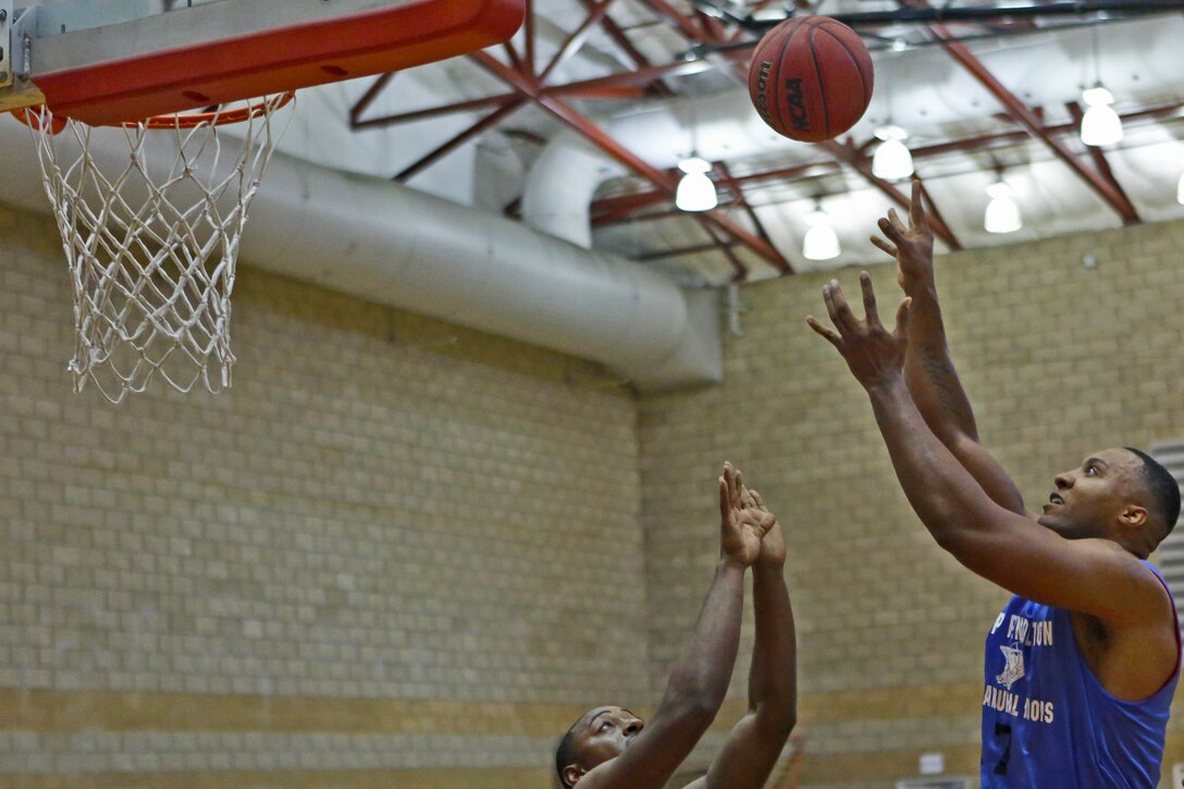 1st Combat Engineer Battalion claimed a 58-44 victory over 9th Communications Battalion in the first round of the playoffs for the Commanding General's Cup basketball league at Paige Fieldhouse, Sept. 22.  1st CEB, the 5th seed, will play the 1st seed, 11th Marines in the semi-finals at the fieldhouse tonight.