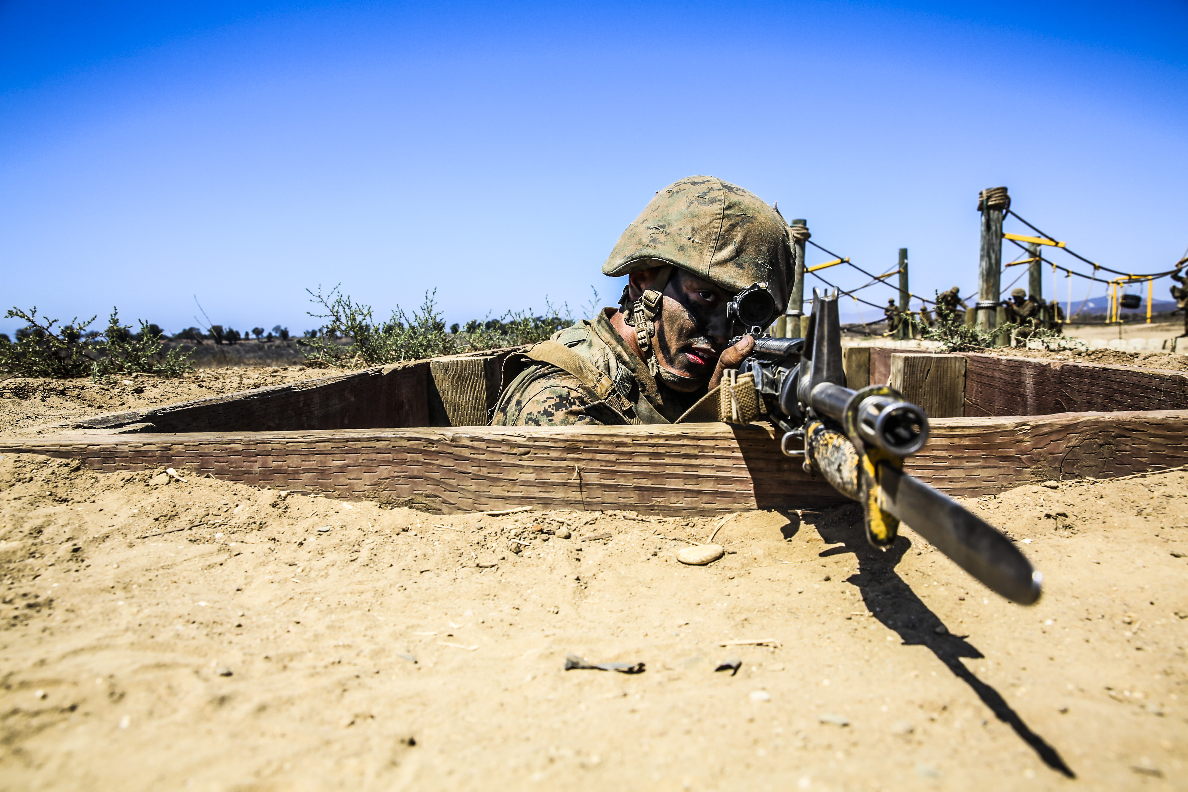 Recruit Brandon M. Hurd, Platoon 3223, provides cover while his fire team advances their position during the Bayonet Assault Course at Edson Range, Marine Corps Base Camp Pendleton, Sept. 10. The Crucible is a 54-hour event where recruits face food and sleep deprivation to simulate the kind of stresses they would face in combat situations. Hurd is a native of Blaine, Minn., and was recruited out of Recruiting Substation Coon Rapids, Minn.