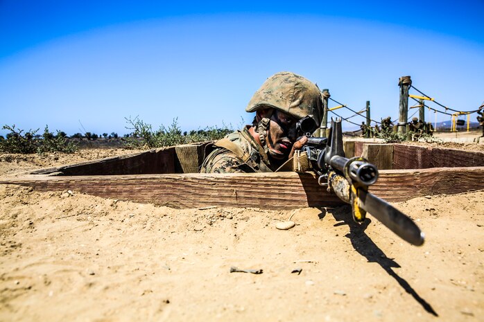 Recruit Brandon M. Hurd, Platoon 3223, provides cover while his fire team advances their position during the Bayonet Assault Course at Edson Range, Marine Corps Base Camp Pendleton, Sept. 10. The Crucible is a 54-hour event where recruits face food and sleep deprivation to simulate the kind of stresses they would face in combat situations. Hurd is a native of Blaine, Minn., and was recruited out of Recruiting Substation Coon Rapids, Minn.
