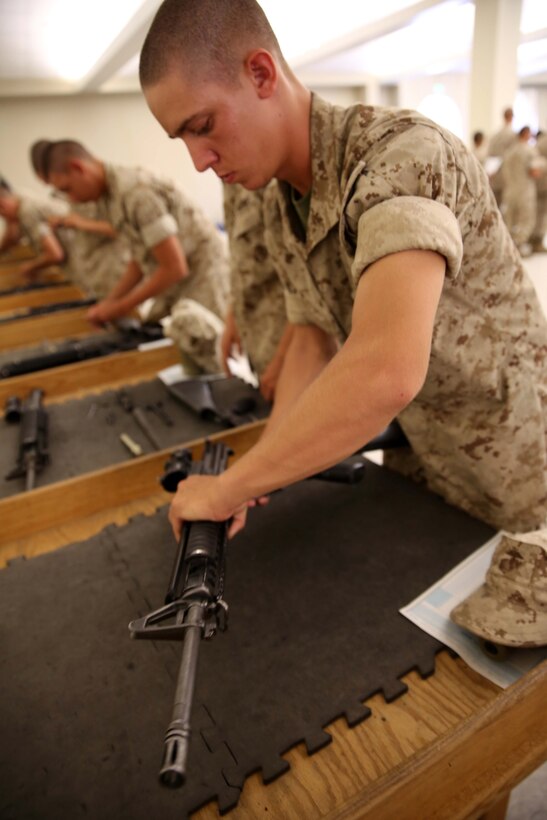 A recruit of Charlie Company, 1st Recruit Training Battalion, reassembles an M-16 A4 Service Rifle at Marine Corps Recruit Depot San Diego, Calif., Sept. 16. Recruits are required to demonstrate their ability to disassemble and reassemble an M-16 A4 service rifle as a graduation requirement. 