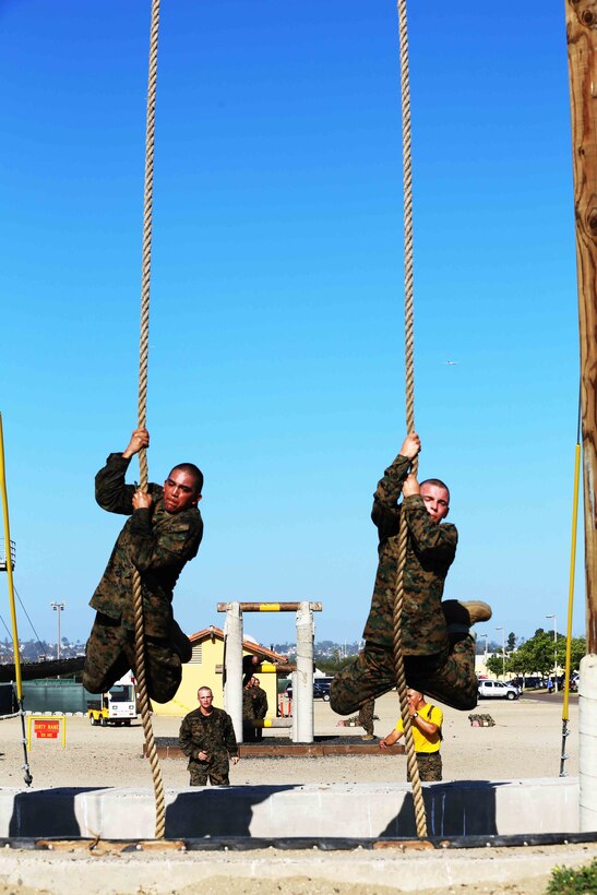 Recruits of Hotel Company, 2nd Recruit Training Battalion, swing over a ditch using a rope during the Confidence Course at Marine Corps Recruit Depot San Diego, Sept. 15. Obstacles in the Confidence Course included the Monkey Bridge, Skyscraper, Wall Climb, The Rope Jump and several others.