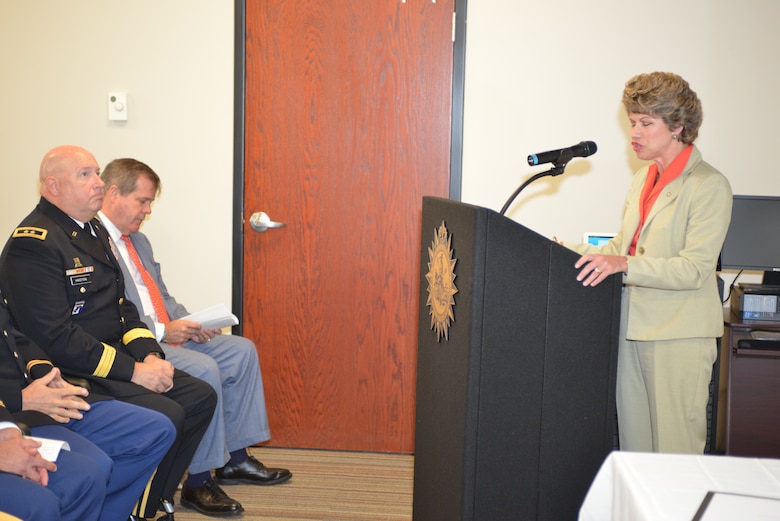 Clarksville Mayor Kim McMillan talks to members of the Tennessee Silver Jackets charter group at Metro Nashville’s Development Services Center during the Tennessee Silver Jackets Charter Signing Ceremony Sept. 23, 2014.  Silver Jackets is an innovative program that provides an opportunity to consistently bring together multiple state, federal, and local agencies to learn from one another and apply their knowledge to reduce risk.