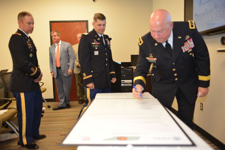 Maj. Gen. Terry M. Haston, Tennessee Adjutant General signs Tennessee Silver Jackets charter Sept. 23, 2014 at Metro Nashville’s Development Services Center. The signing forms a partnership to help reduce flood reduction.  Silver Jackets is an innovative program that provides an opportunity to consistently bring together multiple state, federal, and local agencies to learn from one another and apply their knowledge to reduce risk.