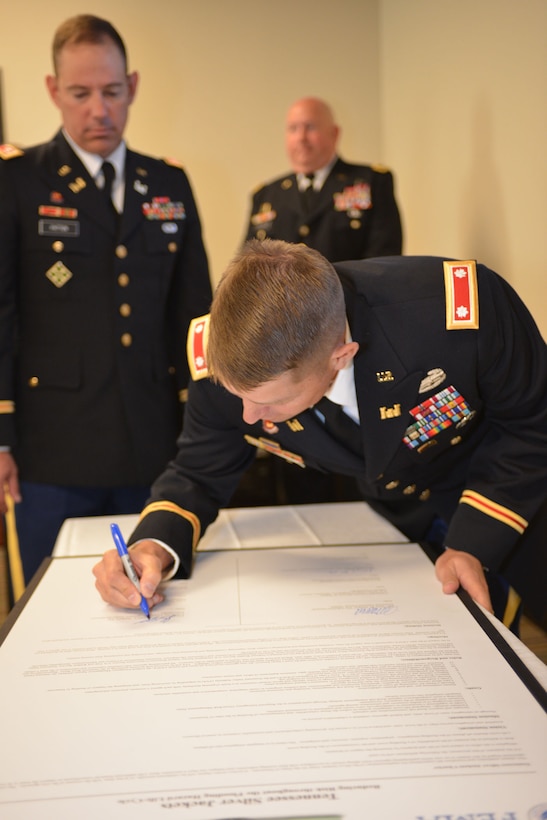 U.S. Army Corps of Engineers Nashville District Commander, John L. Hudson, signs  the Tennessee Silver Jackets charter at a ceremony Sept. 23, 2014 at Metro Nashville’s Development Services Center.  Silver Jackets is an innovative program that provides an opportunity to consistently bring together multiple state, federal, and local agencies to learn from one another and apply their knowledge to reduce risk. 