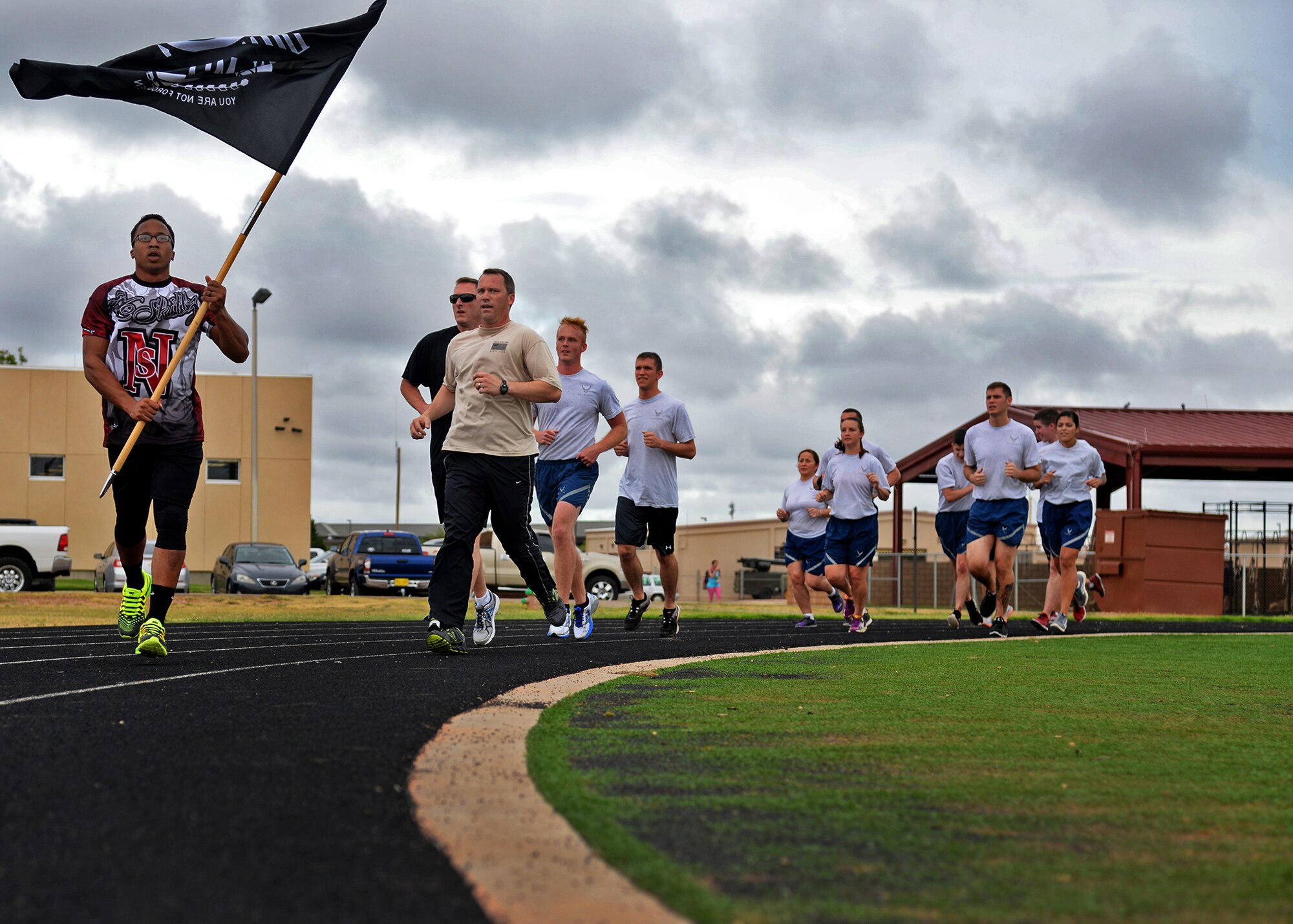 Air Commandos honored Prisoner of War/Missing in Action remembrance week by participating in a 24-hour vigil run Sept. 18, 2014 at Cannon Air Force Base, N.M. The men and women of Team Cannon kept the POW/MIA flag in continuous motion to honor service members who are POW/MIA in an effort to ensure that their legacy will never be forgotten. (U.S. Air Force photo/Airman 1st Class Chip Slack)