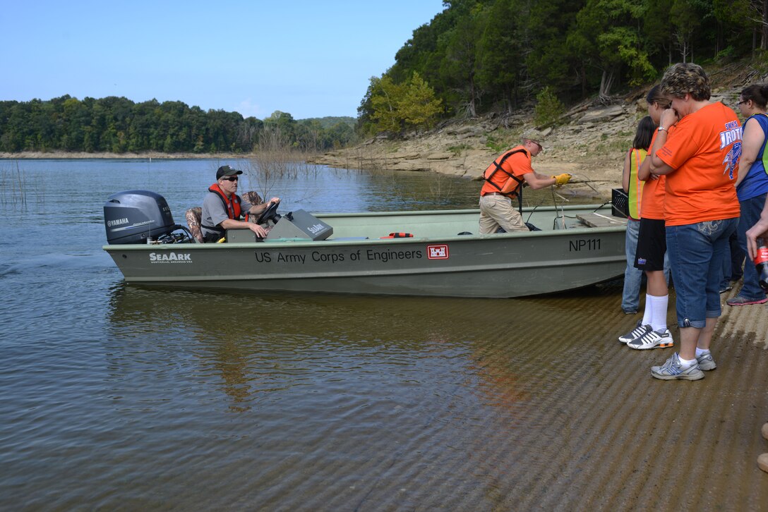 Junior ROTC Students from Southwestern High school in Kentucky unload trash and debris from a U.S.Army Corps of Engineers boat during the Lake Cumberland clean up at Burnside on Sept. 20. Volunteers chose locations at Burnside Island State Park, Cumberland State Resort Park, Conley Bottom Resort, Grider Hill Dock and the Waitsboro Recreation area to clean up. In celebration of National Public Lands Day, 386 volunteers bagged mounds of trash and debris from five designated recreation sites during the 25th Annual Lake Cumberland Cleanup.