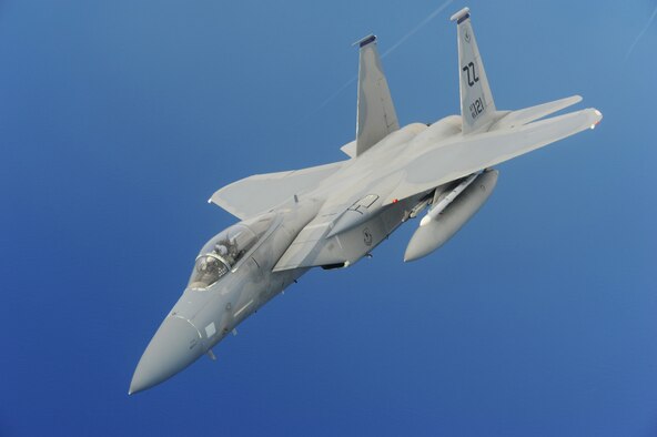 An F-15 aircraft, assigned to the U.S. Air Force's 18th Wing, flies over Guam in support of Exercise Valiant Shield. Valiant Shield is a training exercise with a focus on integration and proficiency of the U.S. Army, Navy, Air Force and Marine Corps through engaging units at sea, in the air, on land, and in cyberspace in response to the mission. (U.S. Navy photo by Mass Communication Specialist 2nd Class Chelsy Alamina)