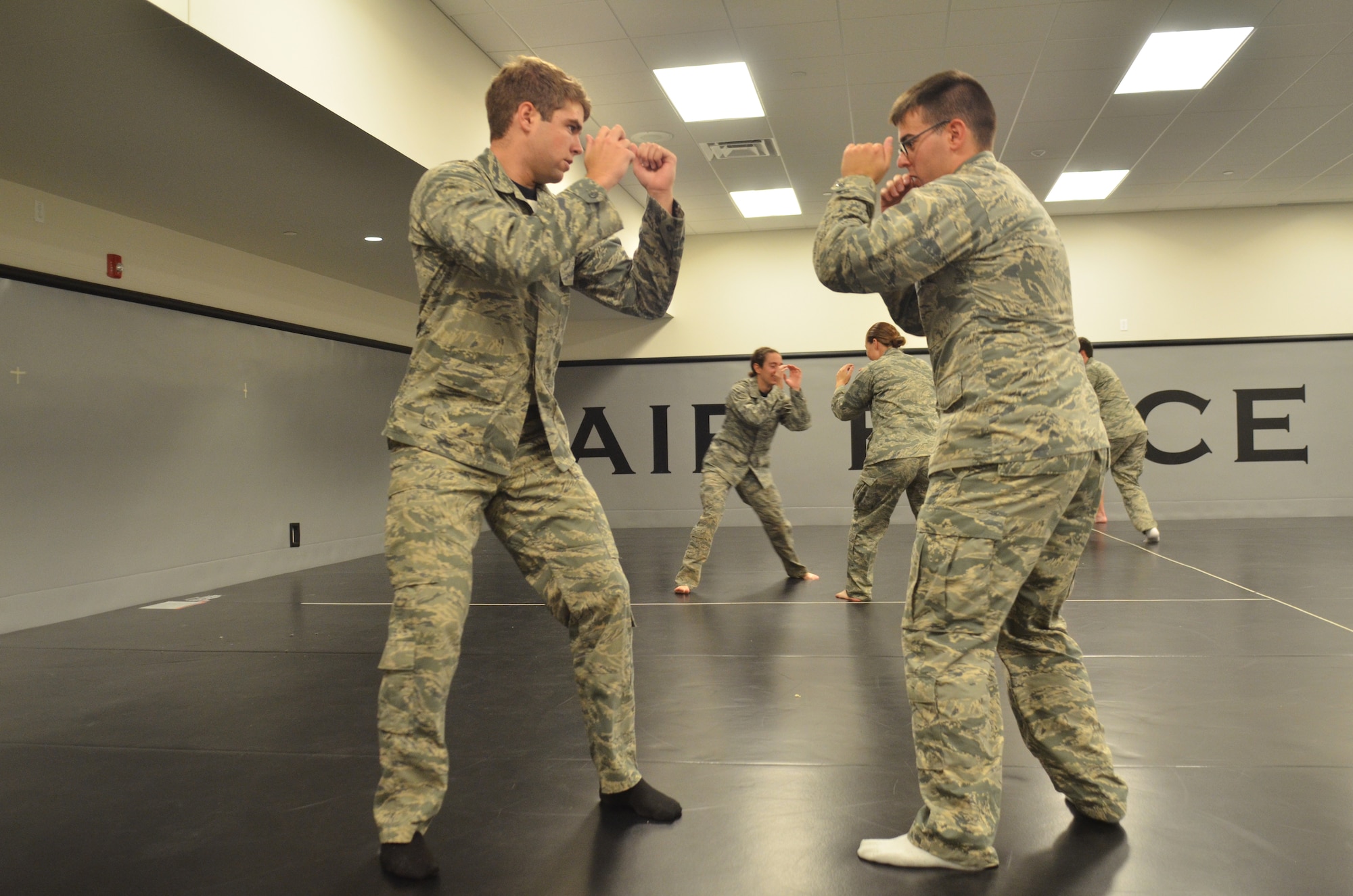 Academy cadets Jackson Bell (left) and Robert Goodno spar during the Academy's Combatives course here Sept. 19. The three-part course is a graduation requirement for cadets. (Air Force photo/Amber Baillie)