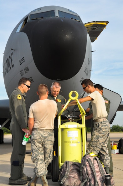 465th Air Refueling Squadron aircrew and maintenance crew chiefs from the 137th Air Refueling Wing, Oklahoma Air National Guard, go through the aircraft forms during pre-flight here Aug. 17. (U.S. Air Force photo/Maj. Jon Quinlan)
