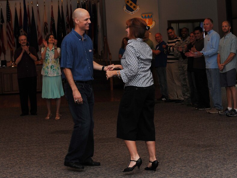 U.S. Air Force Col. Michael Bob Starr, 7th Bomb Wing commander, and his wife, Kim, demonstrate correct dance form during ballroom dance lessons Sept. 12, 2014, at Dyess Air Force Base, Texas. Lessons were offered to those who signed up to participate in the Dyess Air Force Ball. (U.S. Air Force photo by Airman 1st Class Autumn Velez/Released)
