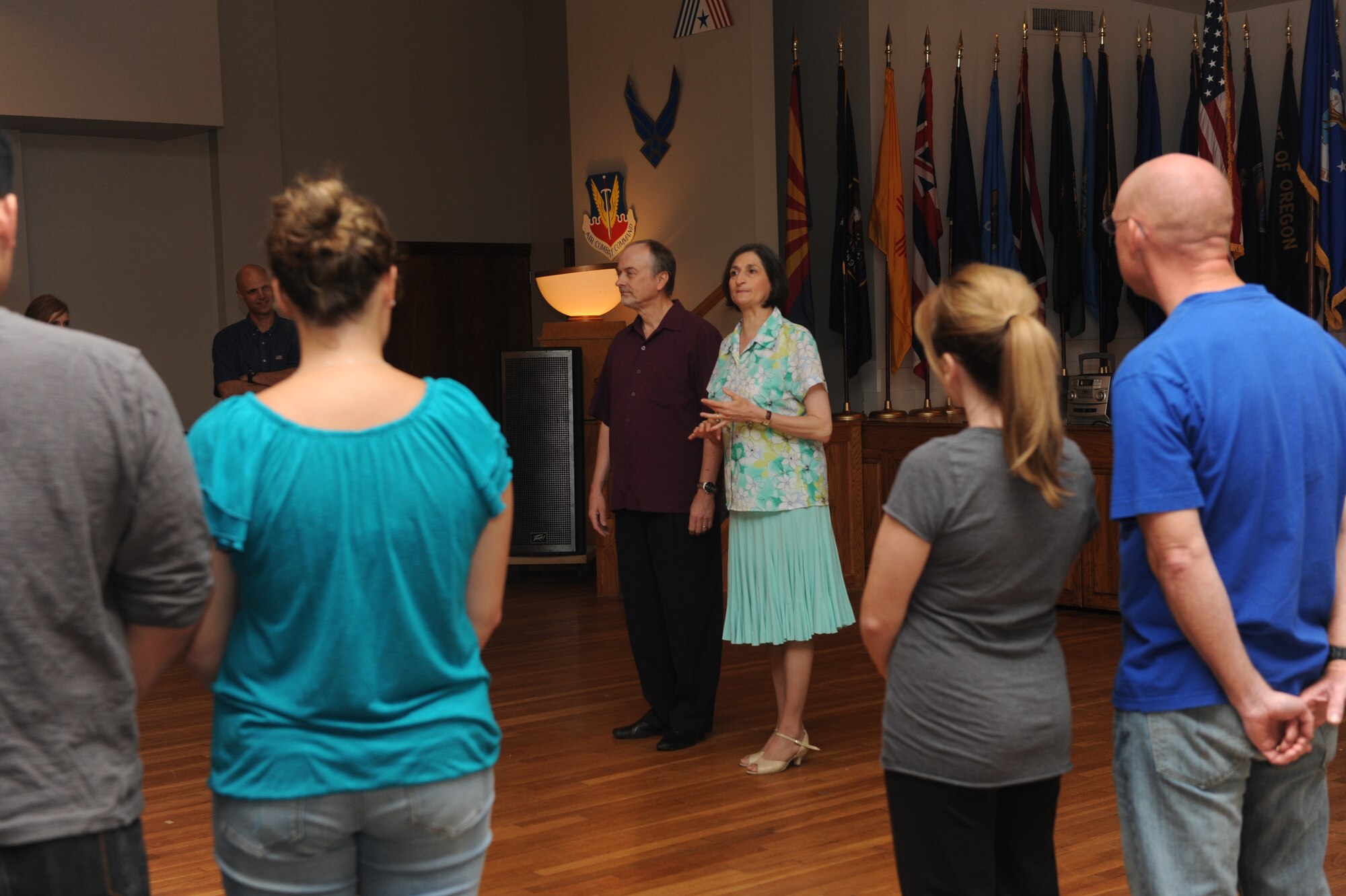 Richard and Sophia Maryianowsk, center, ballroom dance instructors, teach a class on how to dance at social events Sept. 12, 2014, at Dyess Air Force Base, Texas. Col. Michael Bob Starr and his wife, Kim, hosted these lessons to encourage dancing during the Air Force Ball. (U.S. Air Force photo by Airman 1st Class Autumn Velez/Released)