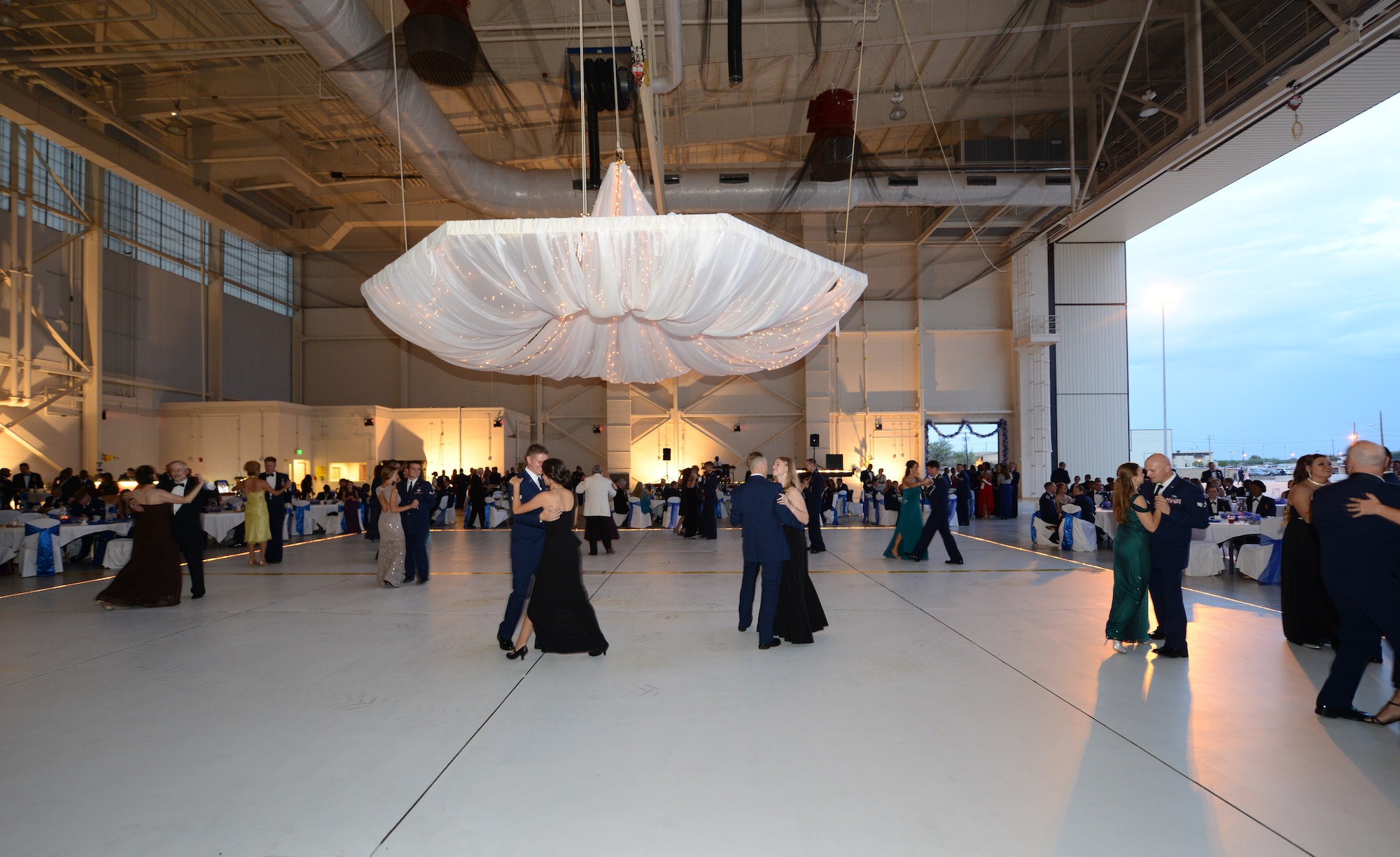 U.S. Air Force members, their families and friends participate in ballroom dancing during the Air Force ball Sept. 20, 2014, at Dyess Air Force Base, Texas. This year’s ball was held in the tradition of a hangar dance complemented with ballroom dancing. In the days leading up to the ball, two ballroom dancing sessions were offered to those participating in the event. (U.S. Air Force photo by Airman 1st Class Kedesha Pennant/Released)

