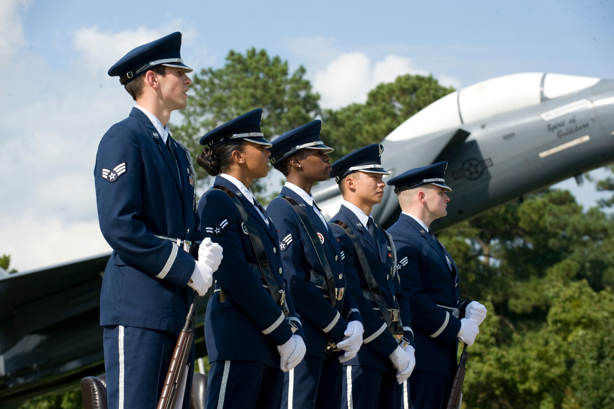The 4th Fighter Wing Honor Guard stands at parade rest during the POW/MIA Ceremony on Sept. 19, 2014, at Seymour Johnson Air Force Base, North Carolina. The ceremony, held in conjunction with national POW/MIA Recognition Day, featured a missing-man formation flyover by four F-15E Strike Eagles assigned to the 4th FW, a reading of the Code of Conduct, a special presentation of the colors and remarks by both Col. Mark Slocum, 4th FW commander, and retired Army colonel and Medal of Honor recipient Walter J. Marm. (U.S. Air Force photo/Airman 1st Class Aaron Jenne)