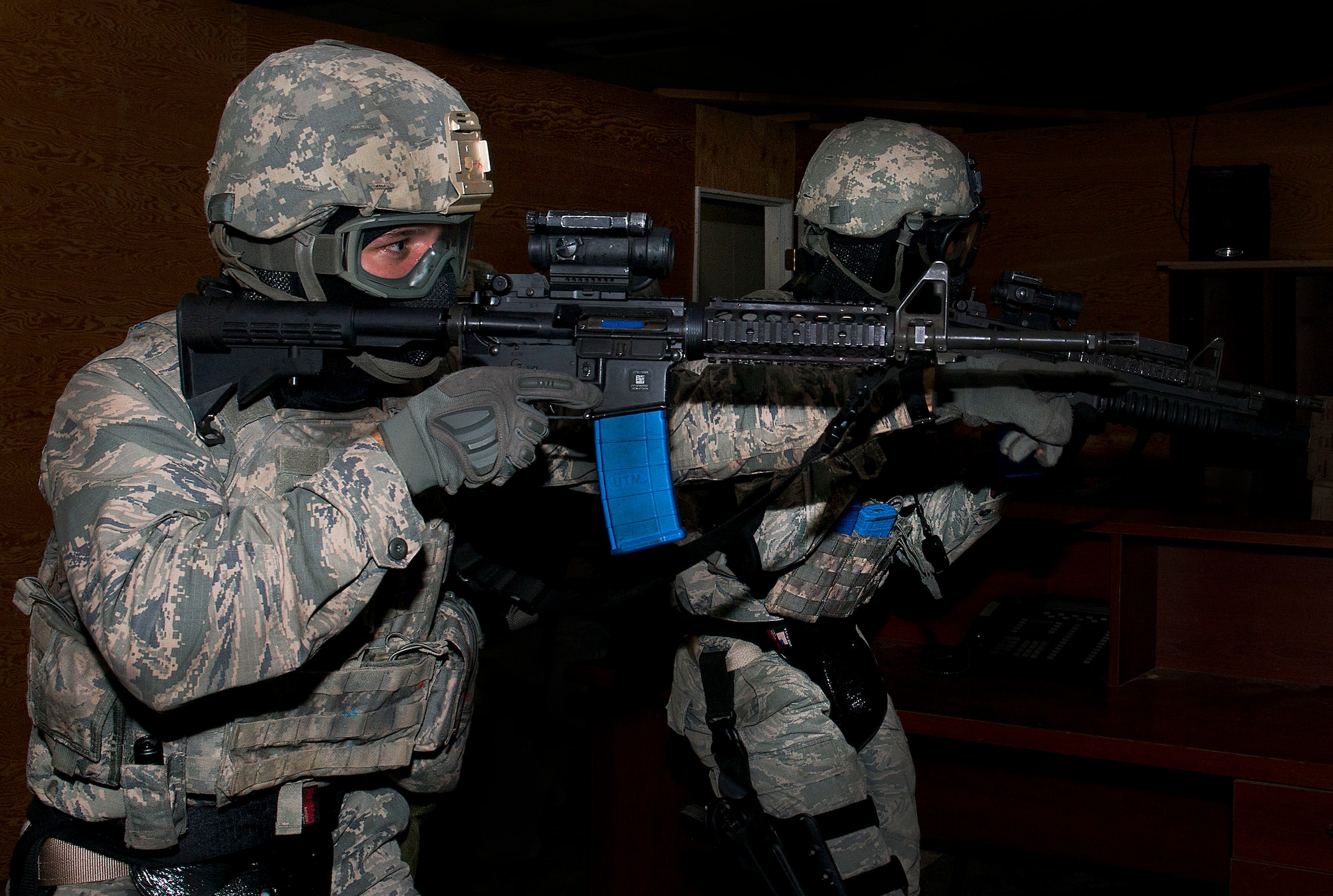 Members of the 5th Security Forces Squadron provide simulated cover for their teammates during a full assault practice on Minot Air Force Base, N.D., Sept. 17, 2014. The team simulated a hostile situation in preparation for the 2014 Air Force Global Strike Challenge. (U.S. Air Force photo/Airman 1st Class Sahara L. Fales)