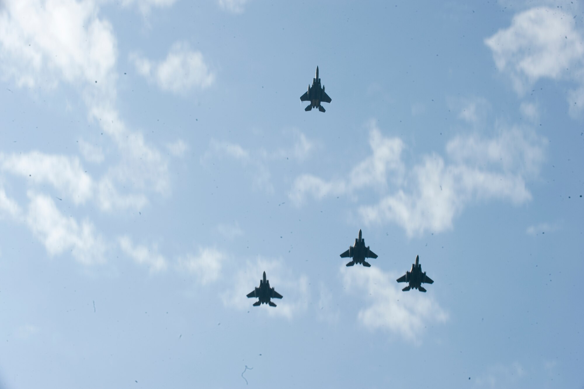 Four F-15E Strike Eagles assigned to the 4th Fighter Wing conduct a missing-man formation flyover during the POW/MIA Ceremony on Sept. 19, 2014, at Seymour Johnson Air Force Base, North Carolina. The ceremony, held in conjunction with national POW/MIA Recognition Day, also featured a reading of the Code of Conduct, a special presentation of the colors and remarks by both Col. Mark Slocum, 4th FW commander, and retired Army colonel and Medal of Honor recipient Walter J. Marm. (U.S. Air Force photo/Airman 1st Class Aaron Jenne)