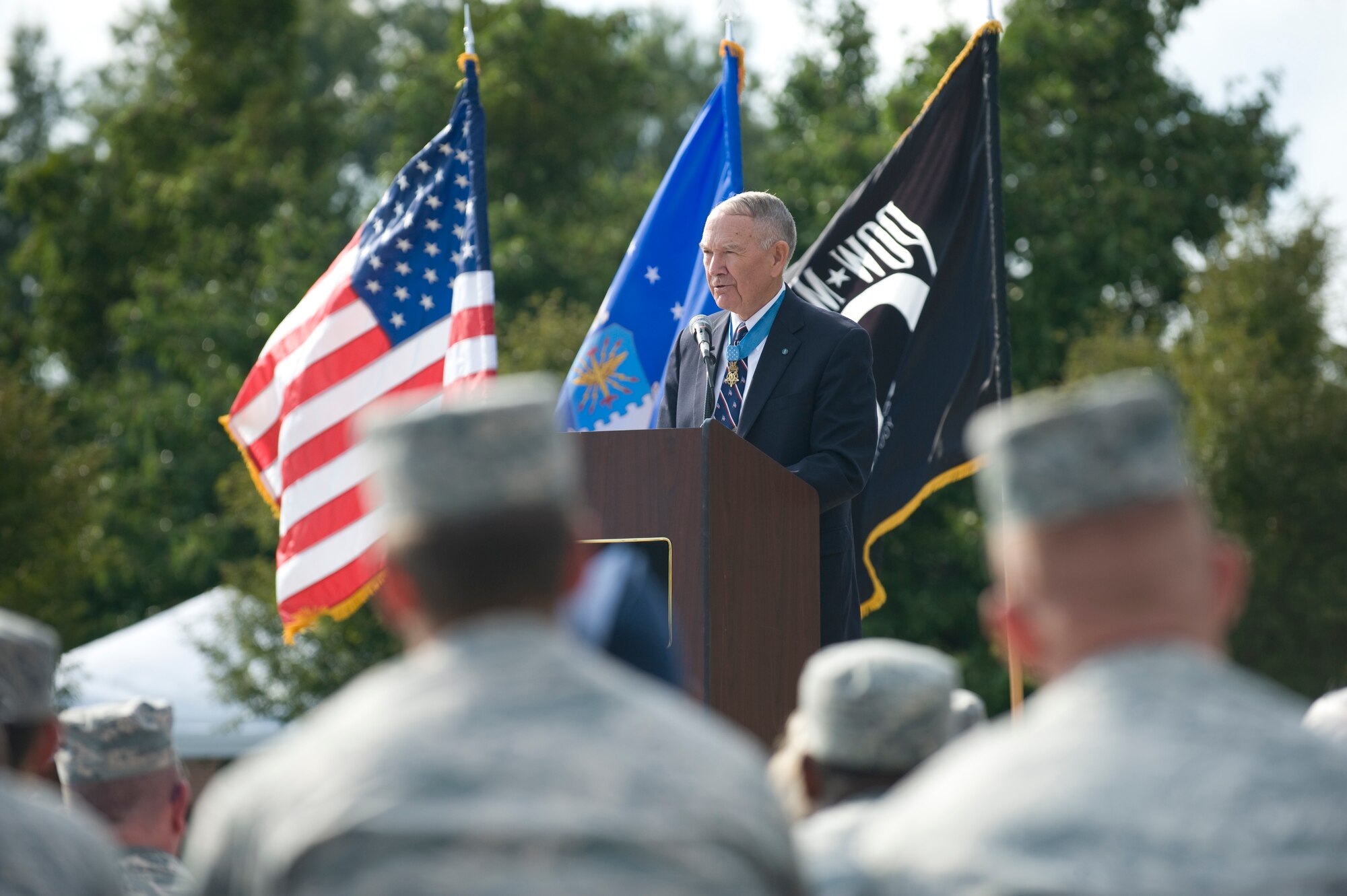 Retired Army colonel and Medal of Honor recipient, Walter J. Marm, speaks during the POW/MIA Ceremony on Sept. 19, 2014, at Seymour Johnson Air Force Base, North Carolina. During his speech, Marm stressed the importance of remembering Americans who’ve endured captivity in enemy hands, as well as those whose fate remains unknown. The ceremony, held in conjunction with national POW/MIA Recognition Day, also featured a missing-man formation flyover by four F-15E Strike Eagles assigned to the 4th Fighter Wing, a reading of the Code of Conduct, a special presentation of the colors and remarks by Col. Mark Slocum, 4th FW commander. (U.S. Air Force photo/Airman 1st Class Aaron Jenne)