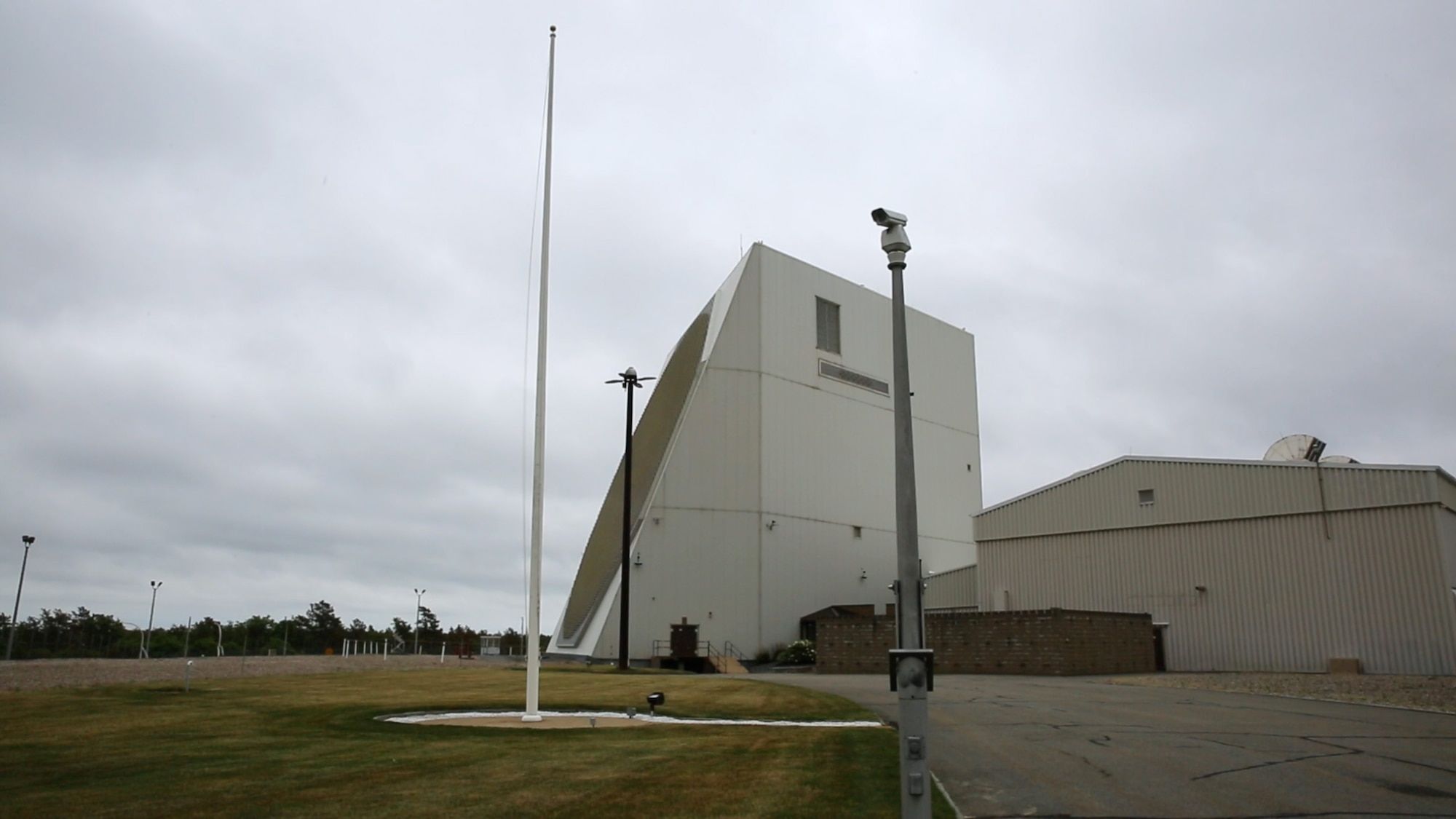 The Phased Array Warning System, called PAVE PAWS, at Joint Base Cape Cod, Mass., operates 24 hours a day, 365 days a year, and has a 3,000-mile reach down the east coast and over the Atlantic Ocean. A wind turbine there provides 50 percent of the power needed to operate the system. (U.S. Air Force photo/Eddie Green/Released)